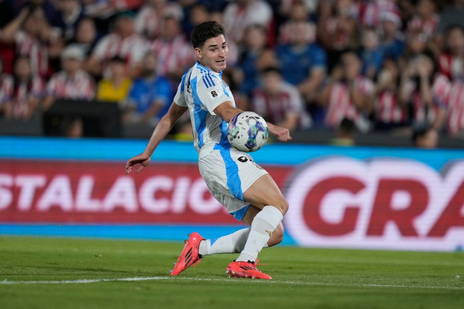 FILE - Argentina's Julian Alvarez controls the ball during a qualifying soccer match for the FIFA World Cup 2026 against Paraguay in Asuncion, Paraguay, Thursday, Nov. 14, 2024. (AP Photo/Jorge Saenz, File)