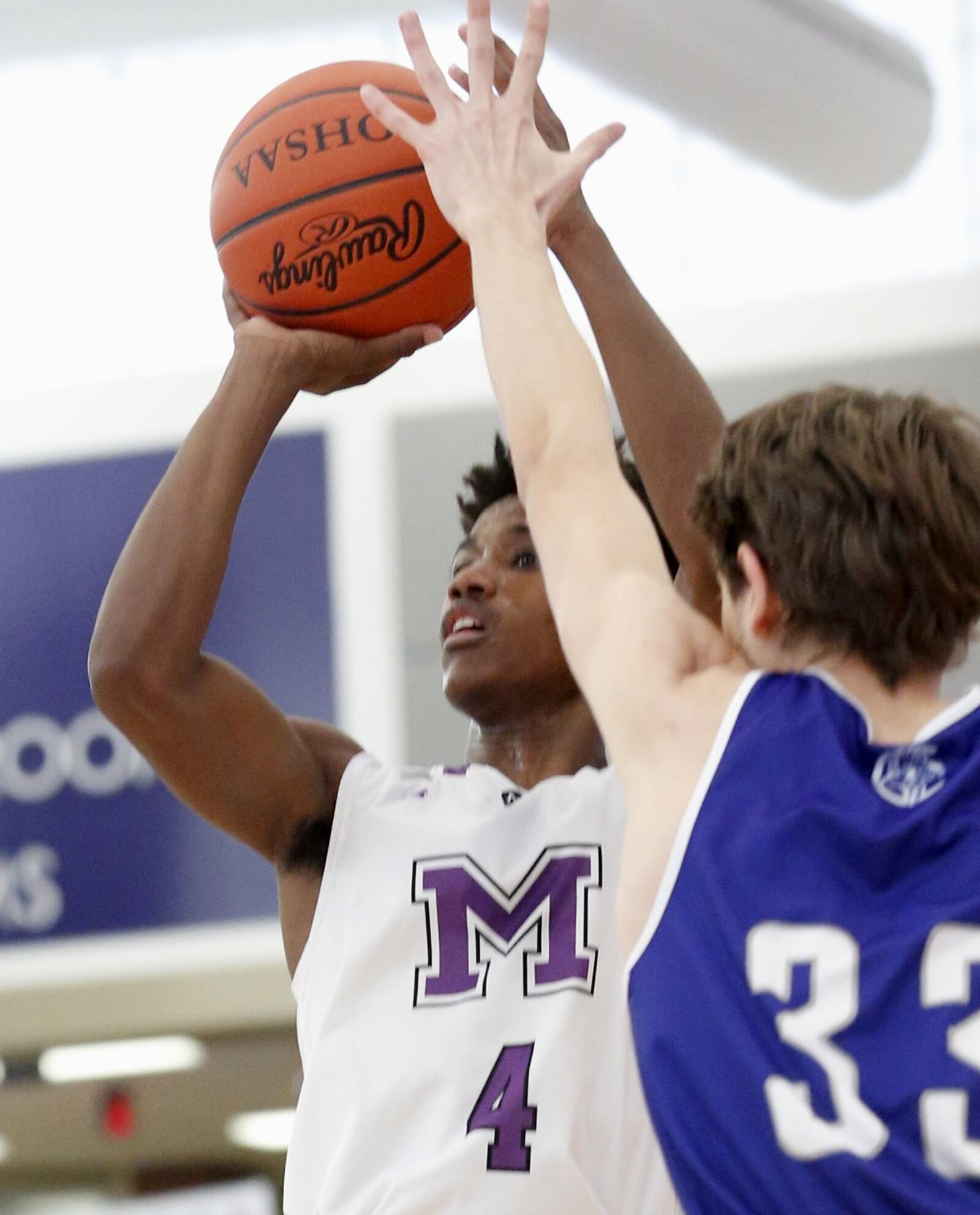 Middletown guard Aaron Jones shoots over Steven Lazar of Crestwood Prep (Canada) on Sunday during the inaugural Midwest King Classic at Wade E. Miller Arena in Middletown. Crestwood won 64-50. CONTRIBUTED PHOTO BY E.L. HUBBARD