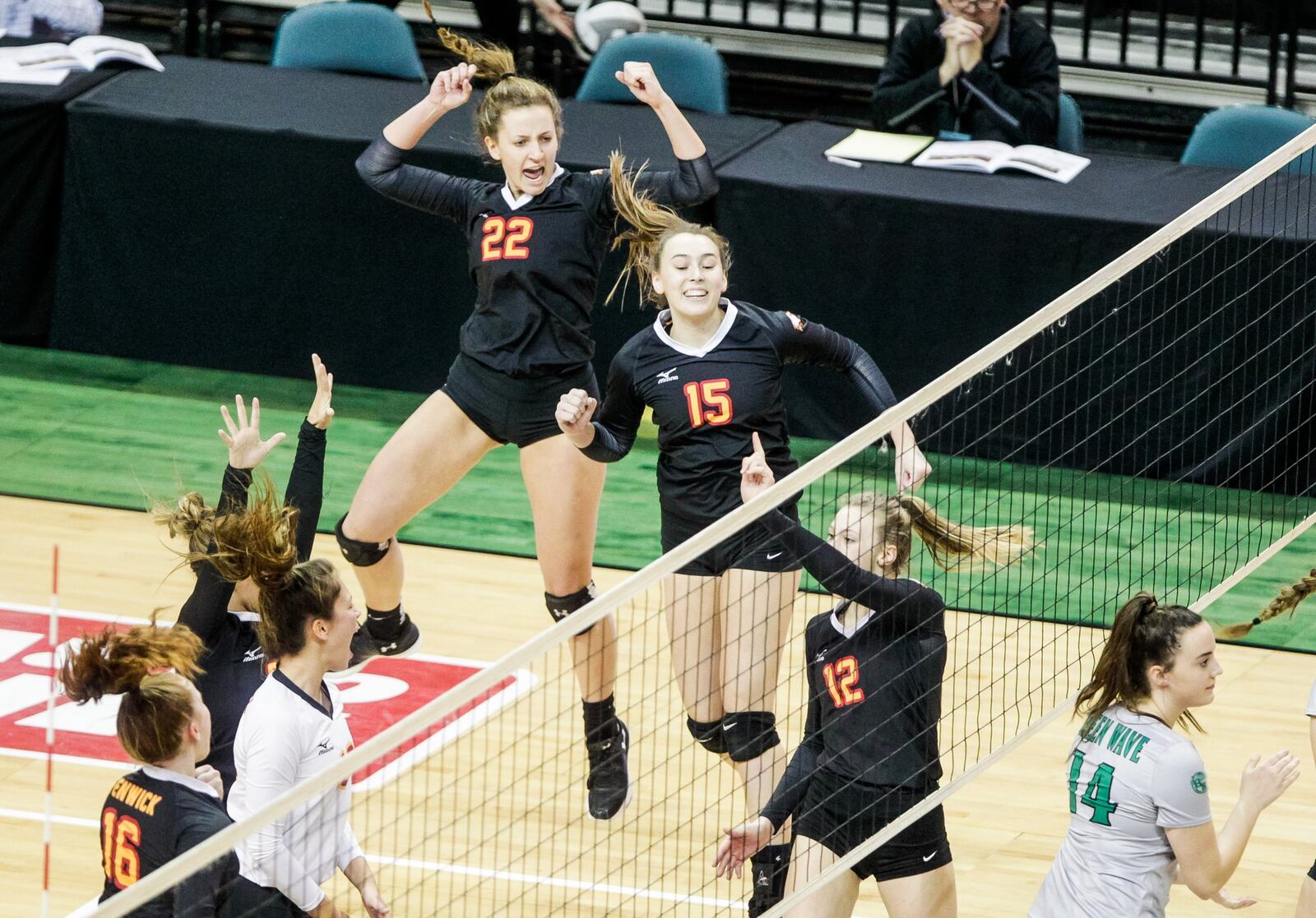 Fenwick’s Emma Schaefer (22), Julia Gardon (15) and Kate Hafer (12) show their emotion during Friday’s Division II state volleyball semifinal against Parma Heights Holy Name at Wright State University’s Nutter Center. NICK GRAHAM/STAFF