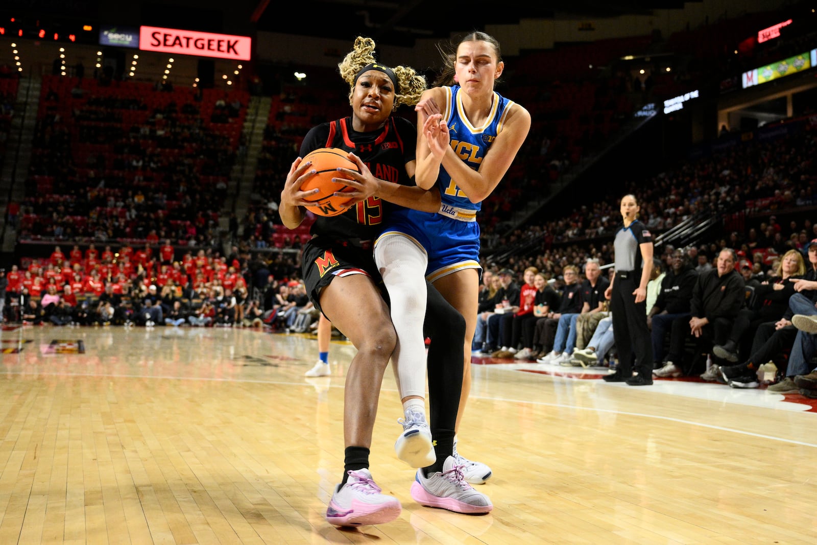 UCLA guard Gabriela Jaquez, right, fouls Maryland forward Christina Dalce, left, during the first half of an NCAA college basketball game, Sunday, Jan. 26, 2025, in College Park, Md. (AP Photo/Nick Wass)