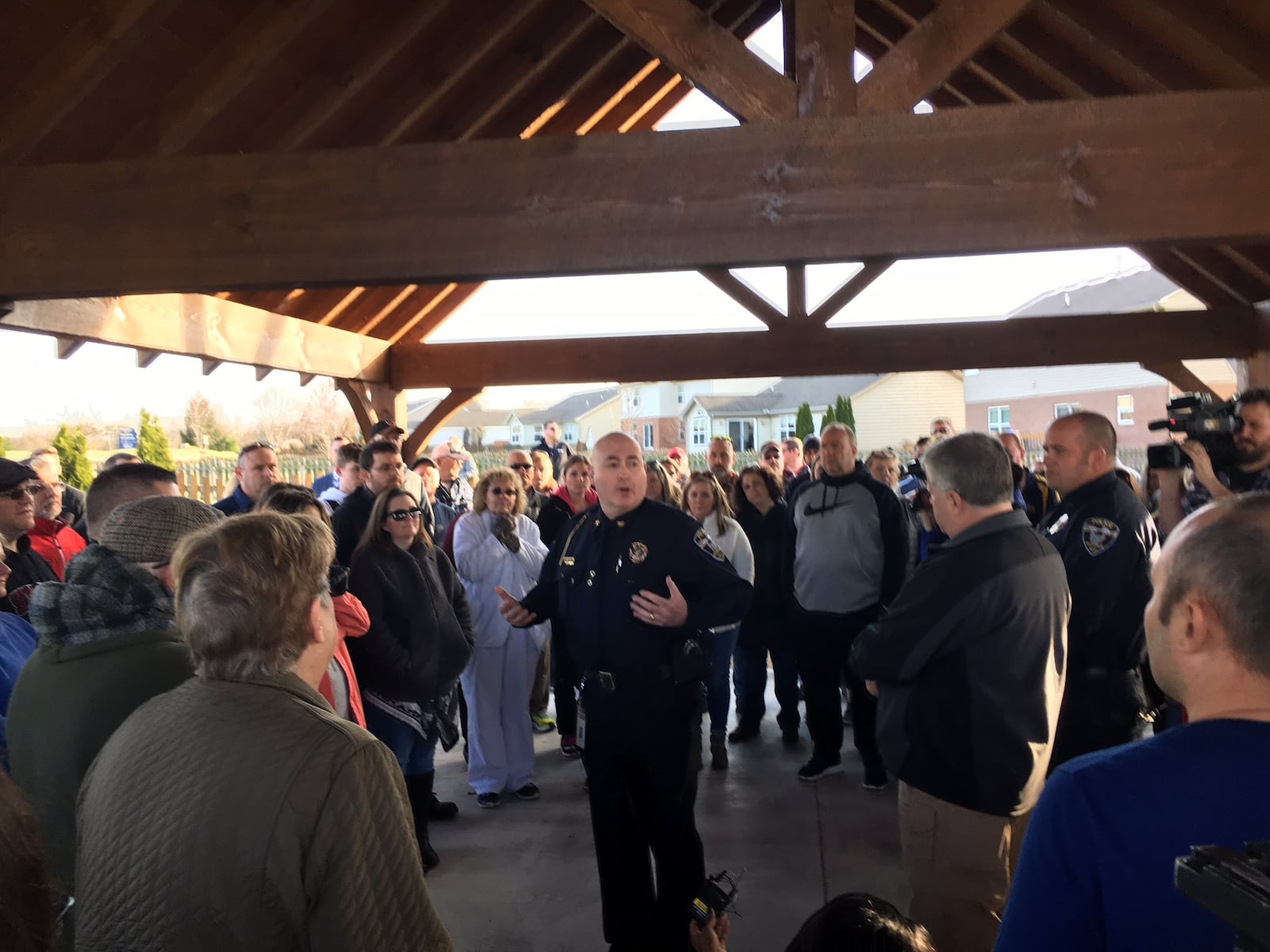 Nearly 100 residents of the Monroe Crossings subdivision hear from Monroe Police Chief Bob Buchanan about a pair of drive-by shootings over the weekend in the 400 block of Brandon Drive. Buchanan gave residents an update on the investigation and asked them for any information or home security videos that could aid in the investigation. ED RICHTER/STAFF