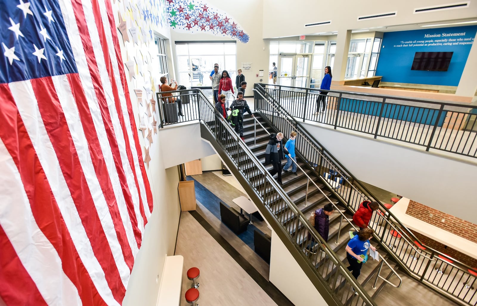 Kids file in to the new Boys and Girls Club of West Chester/Liberty building for a tour Wednesday, Dec. 20. Sixty children took a field trip from the current location to see what they will move in to after the holiday break. NICK GRAHAM/STAFF