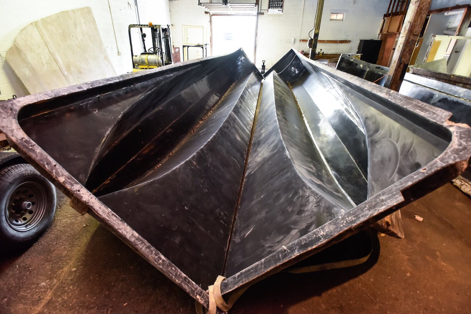 Water Taxi Marine recently bought a building on Forest Avenue in Hamilton to construct boats. Owner Todd Allmand started in the boat business with his dad in Miami, Florida but moved to Ohio due to lower freight cost when shipping his boats, some of which are nearly forty feet long and twelve feet wide. This is a mold that will be used to construct a fiberglass hull for a catamaran. NICK GRAHAM/STAFF