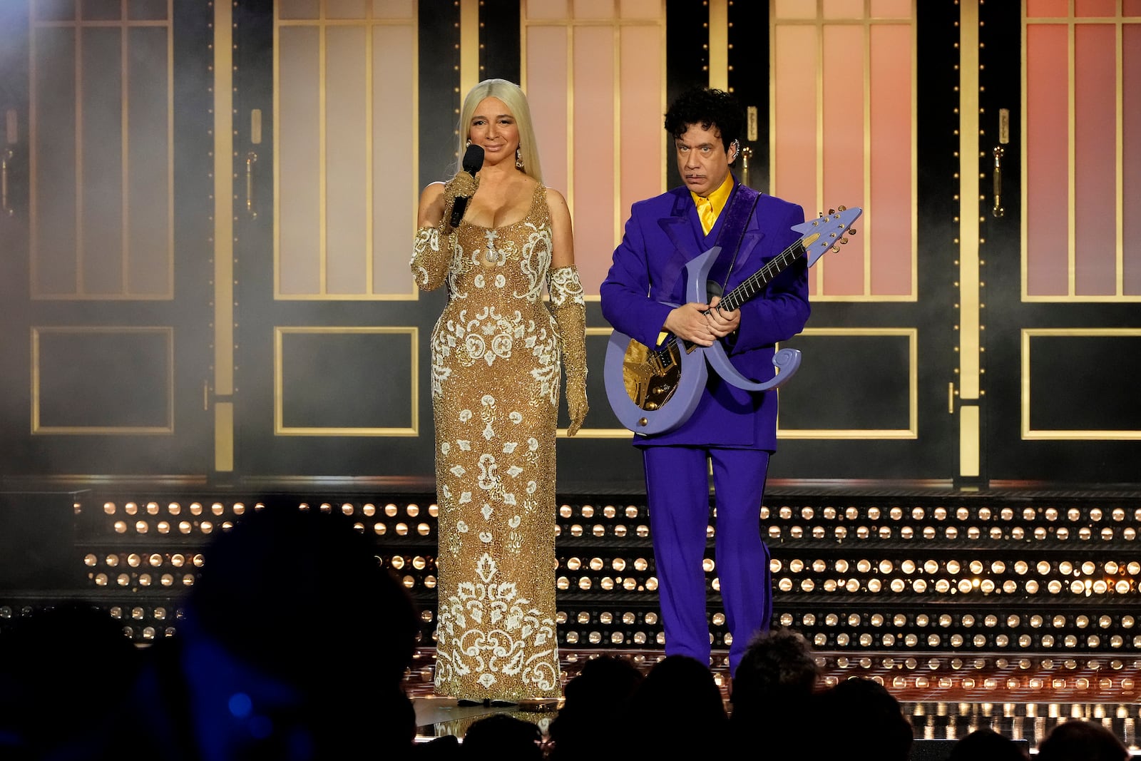 This image released by Peacock shows Maya Rudolph, left, and Fred Armisen during "SNL50: The Homecoming Concert" on Friday, Feb. 14, 2025, in New York. (Virginia Sherwood/Peacock via AP)