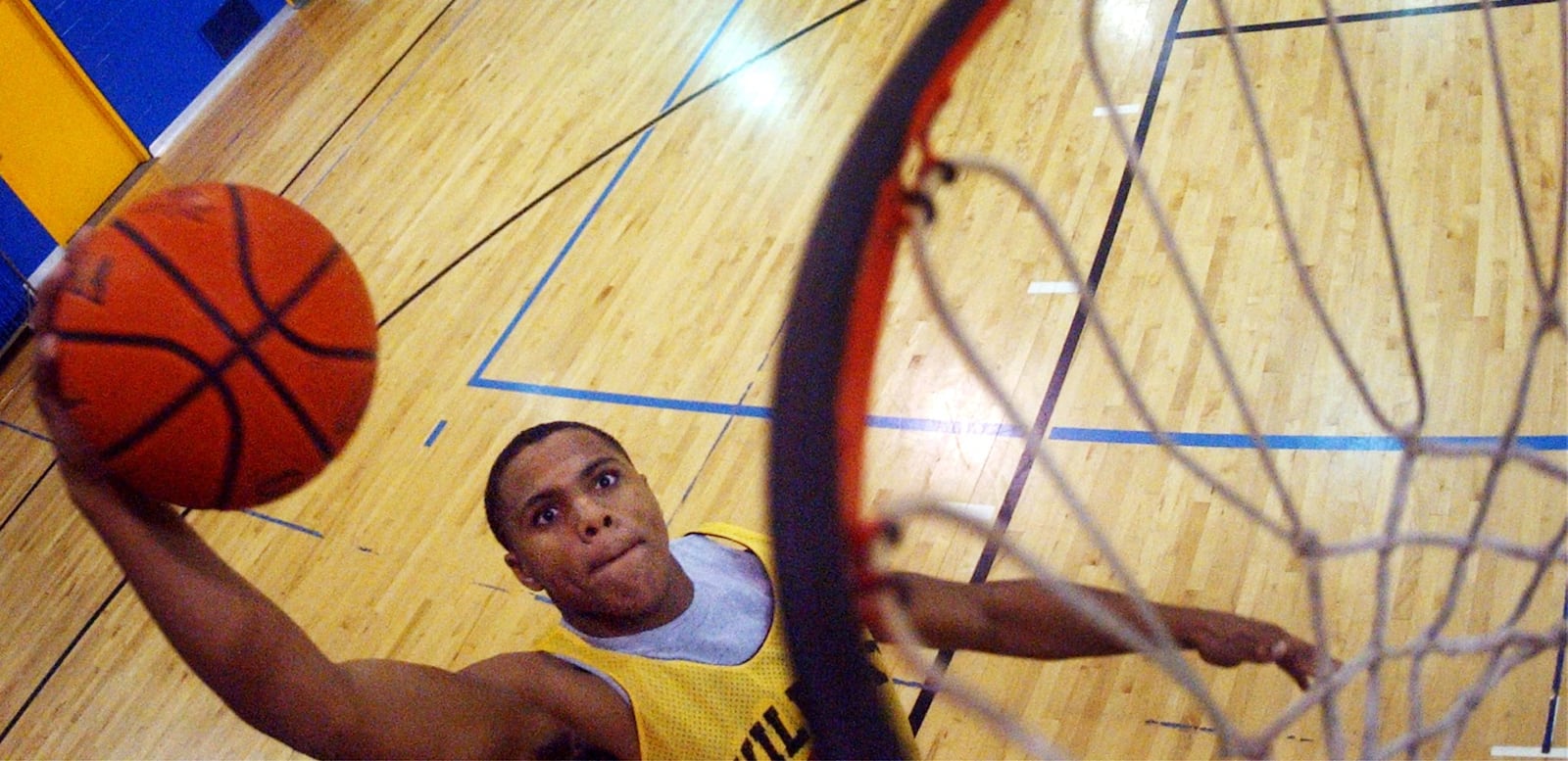 South High School's Nate Miller goes for a slam dunk during practice in December 2004. FILE / TEESHA MCCLAM