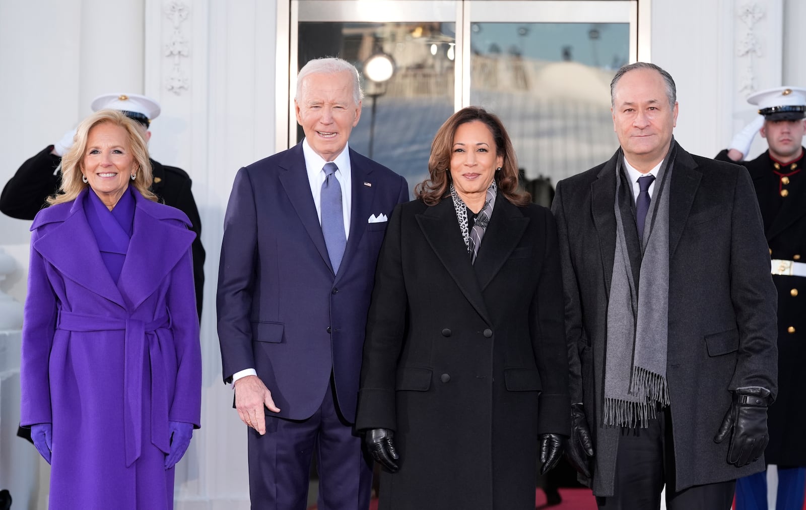 President Joe Biden and first lady Jill Biden greet Vice President Kamala Harris and second gentleman Doug Emhoff upon their arrival at the White House, Monday, Jan. 20, 2025, in Washington. (AP Photo/Alex Brandon)