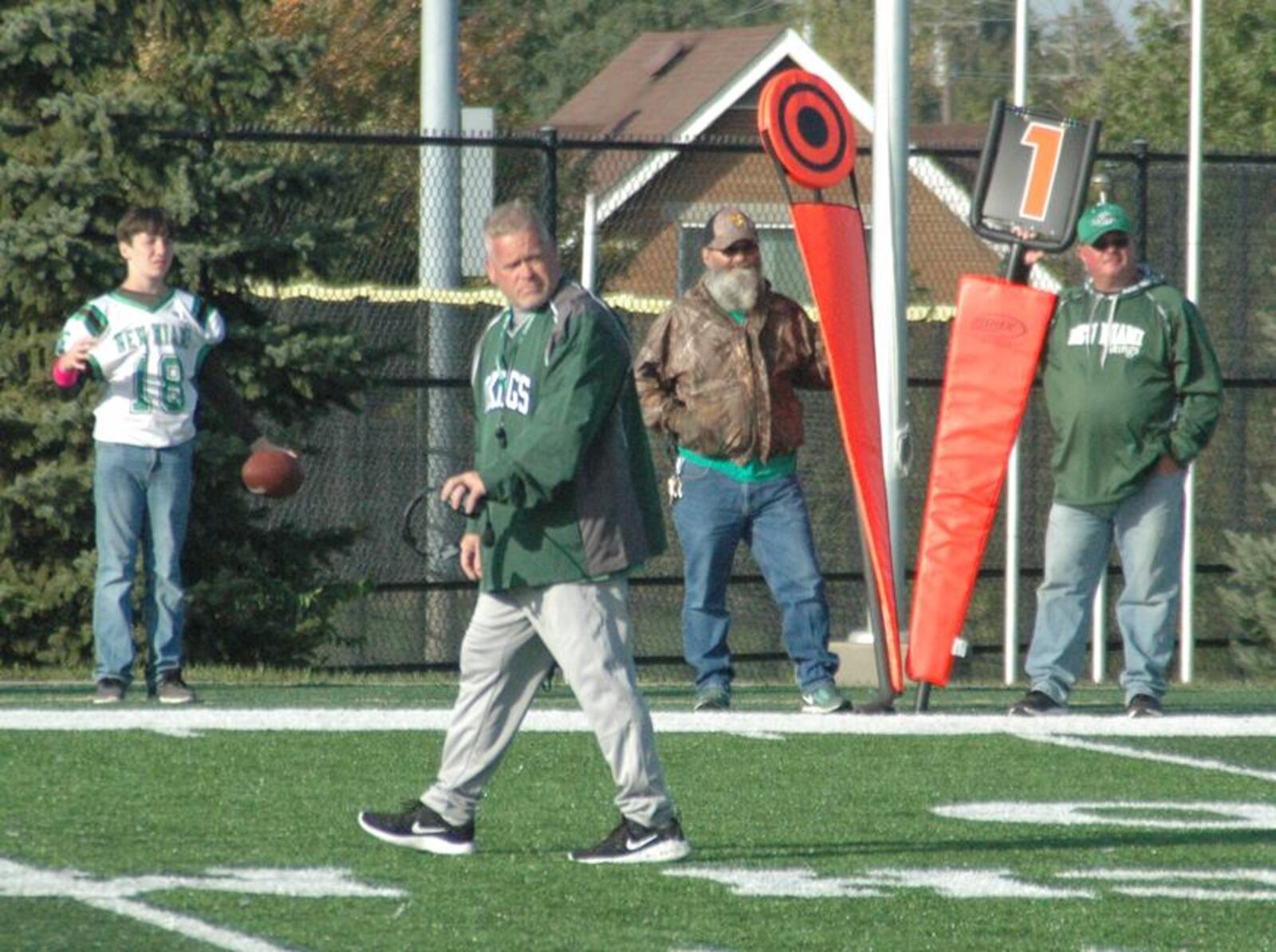 New Miami coach Jessie Hubbard heads back to the sideline after a timeout Oct. 13 during a 36-8 victory over Cincinnati College Prep Academy at Western Hills. RICK CASSANO/STAFF