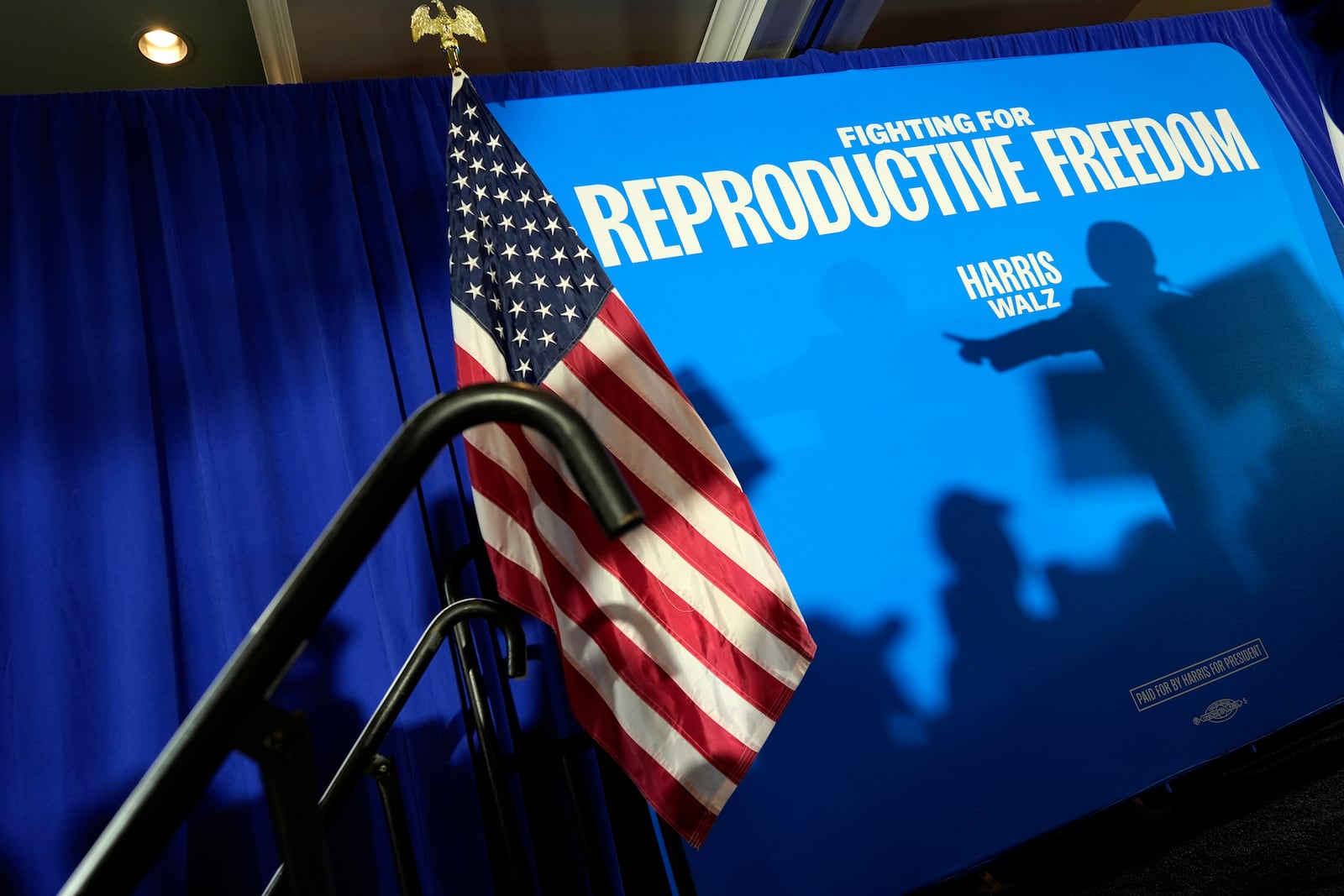 FILE - The shadow of Sen. Amy Klobuchar, D-Minn., is cast on a backdrop as she speaks at an event kicking off a national "Reproductive Freedom Bus Tour" by the campaign of Democratic presidential nominee Vice President Kamala Harris and running mate Gov. Tim Walz, Tuesday, Sept. 3, 2024, in Boynton Beach, Fla. (AP Photo/Rebecca Blackwell, File)