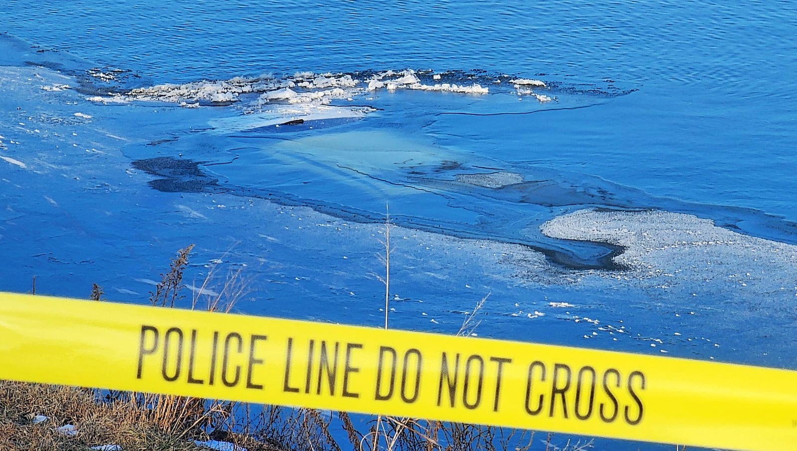 A vehicle was reported to be submerged in the Great Miami River on Tuesday, Jan. 21, 2025, a couple hundred feet south of the Columbia Road bridge in Hamilton. NICK GRAHAM/STAFF