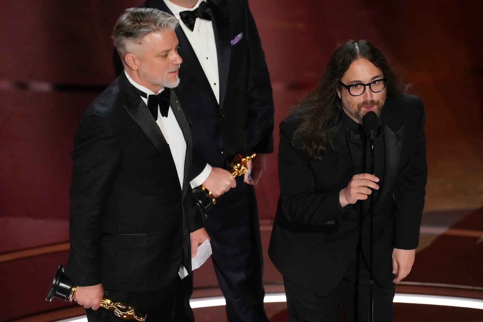 FILE - Dave Mullins, left, and Sean Ono Lennon accept the award for best animated short for "War Is Over! Inspired by the Music of John & Yoko" during the Oscars on March 10, 2024, in Los Angeles. (AP Photo/Chris Pizzello, File)