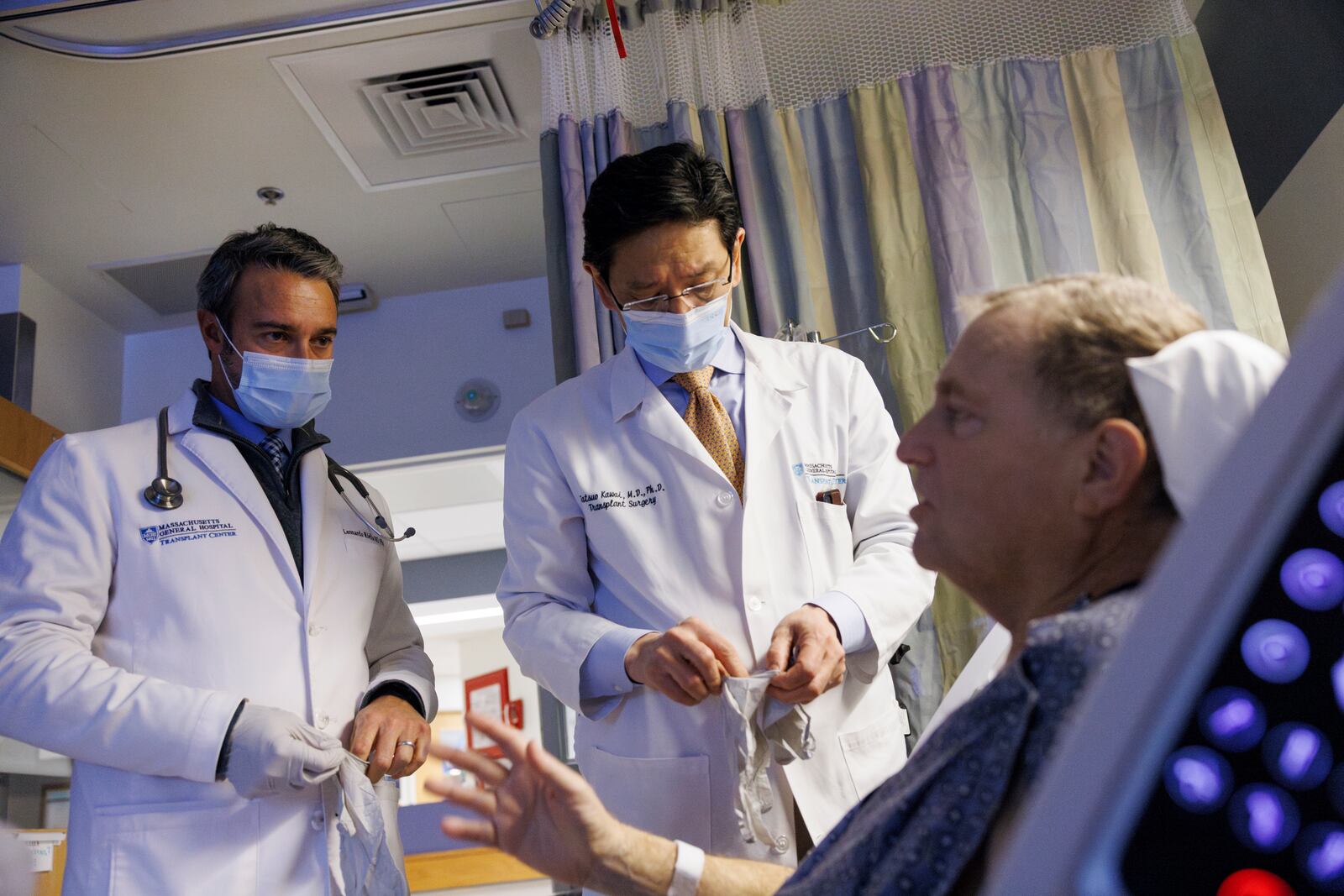 Tim Andrews speaks with Dr. Leonardo Riella, left, and Dr. Tatsuo Kawai prior to his discharge from Massachusetts General Hospital in Boston on Feb. 1, 2025. (Kate Flock/Massachusetts General Hospital via AP)