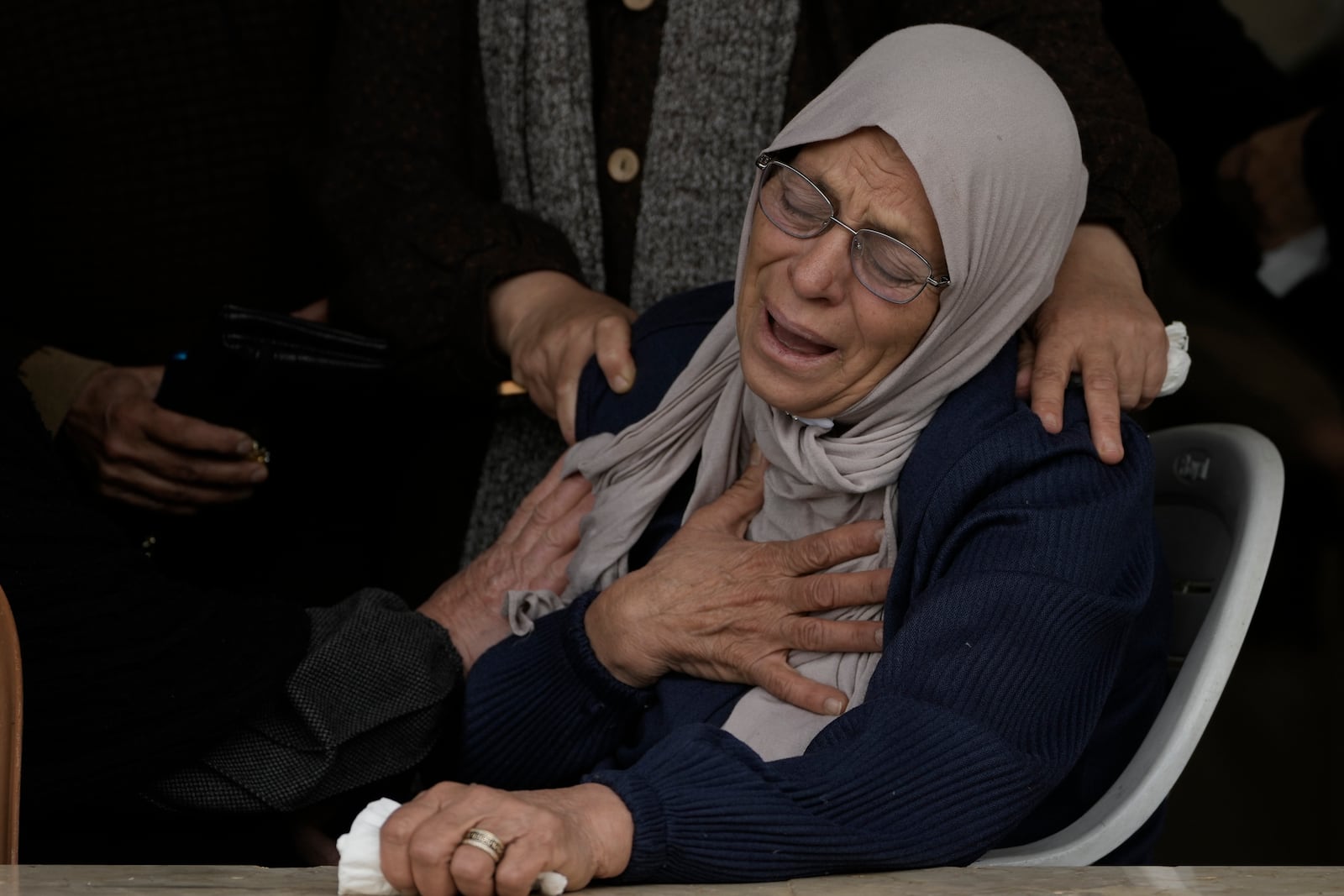 Mourners attend the funeral of Ahmad Nimer Al-Shaib who he was killed during an Israeli military operation in Jenin, in the West Bank village of Bruqin , Wednesday, Jan. 22, 2025. (AP Photo/Majdi Mohammed)