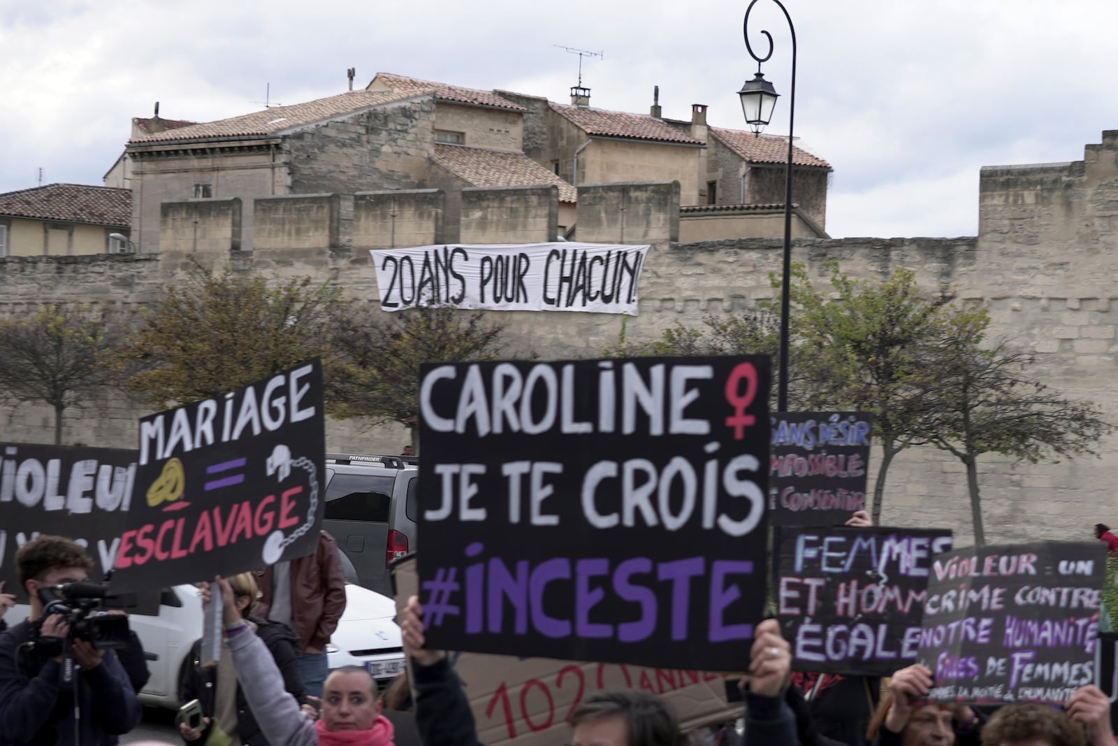 Women demonstrate to mark the International Day for the Elimination of Violence against Women, as the trial of dozens of men accused of raping Gisele Pelicot while she was drugged and rendered unconscious by her husband goes on, Monday, Nov. 25, 2024 in Avignon, southern France. (AP Photo/John Leicester)