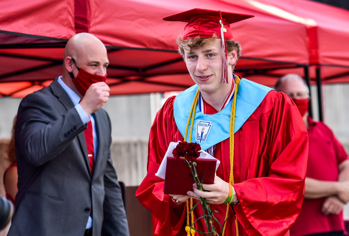 Madison High School drive-thru graduation ceremony at Land of Illusion