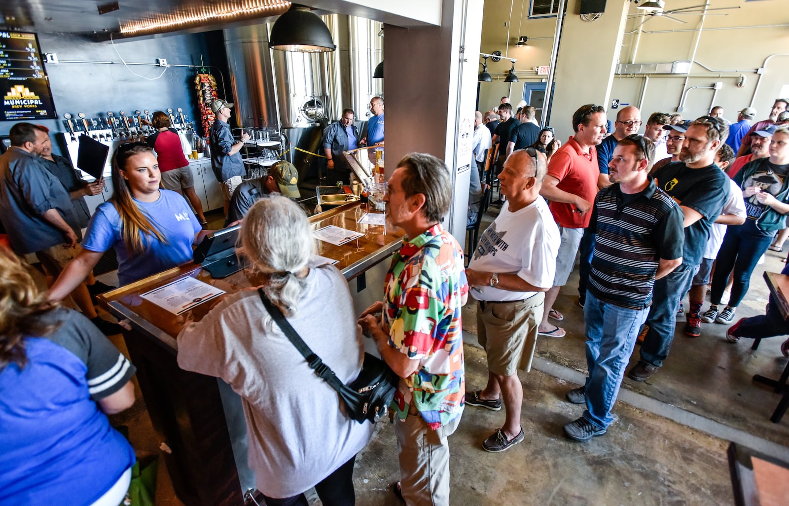 Municipal Brew Works on the back side of the old Municipal building at 20 High Street held their grand opening Wednesday, June 8, 2016 in Hamilton. NICK GRAHAM/STAFF