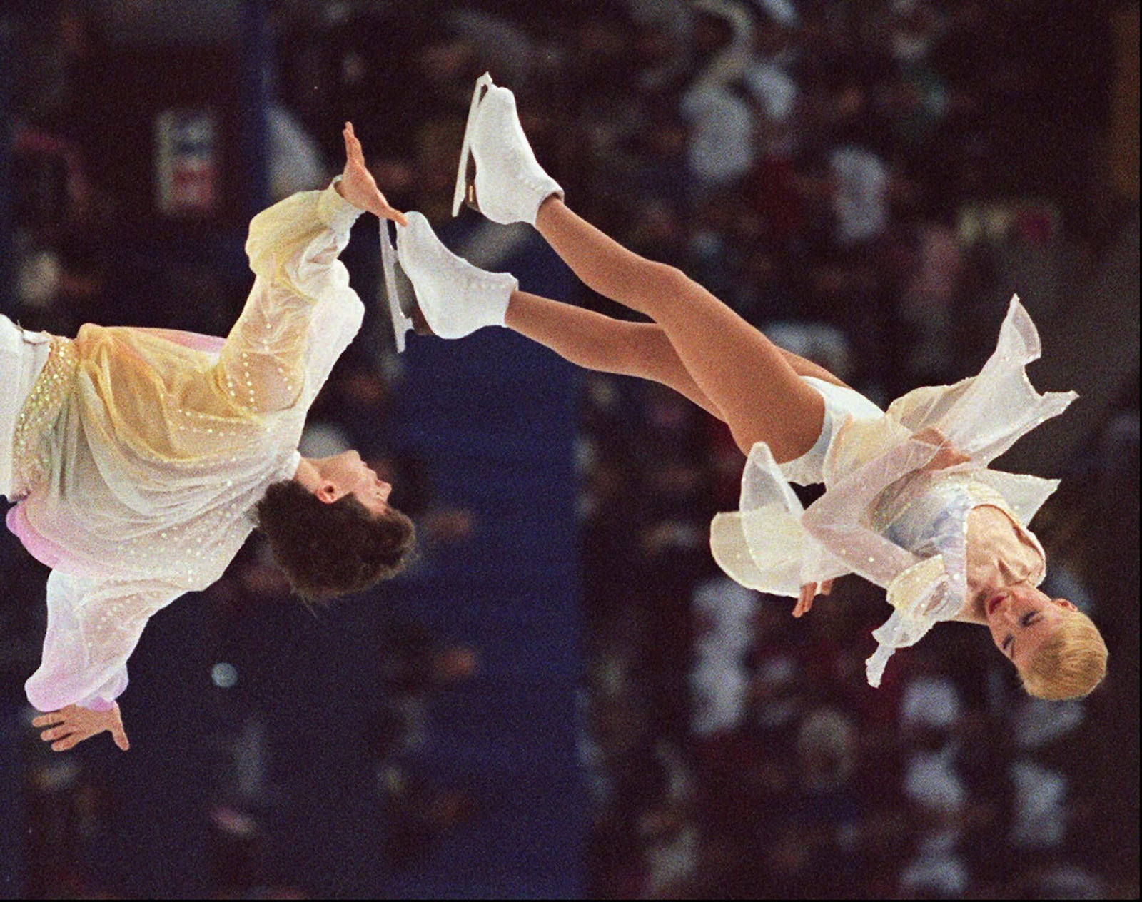 FILE - World champions Evgenia Shishkova and Vadim Naumov of Russia execute a throw during the pairs short competition at the World Figure Skating competition in Edmonton, Alberta, March 19, 1996. (AP Photo/Dave Buston, File)