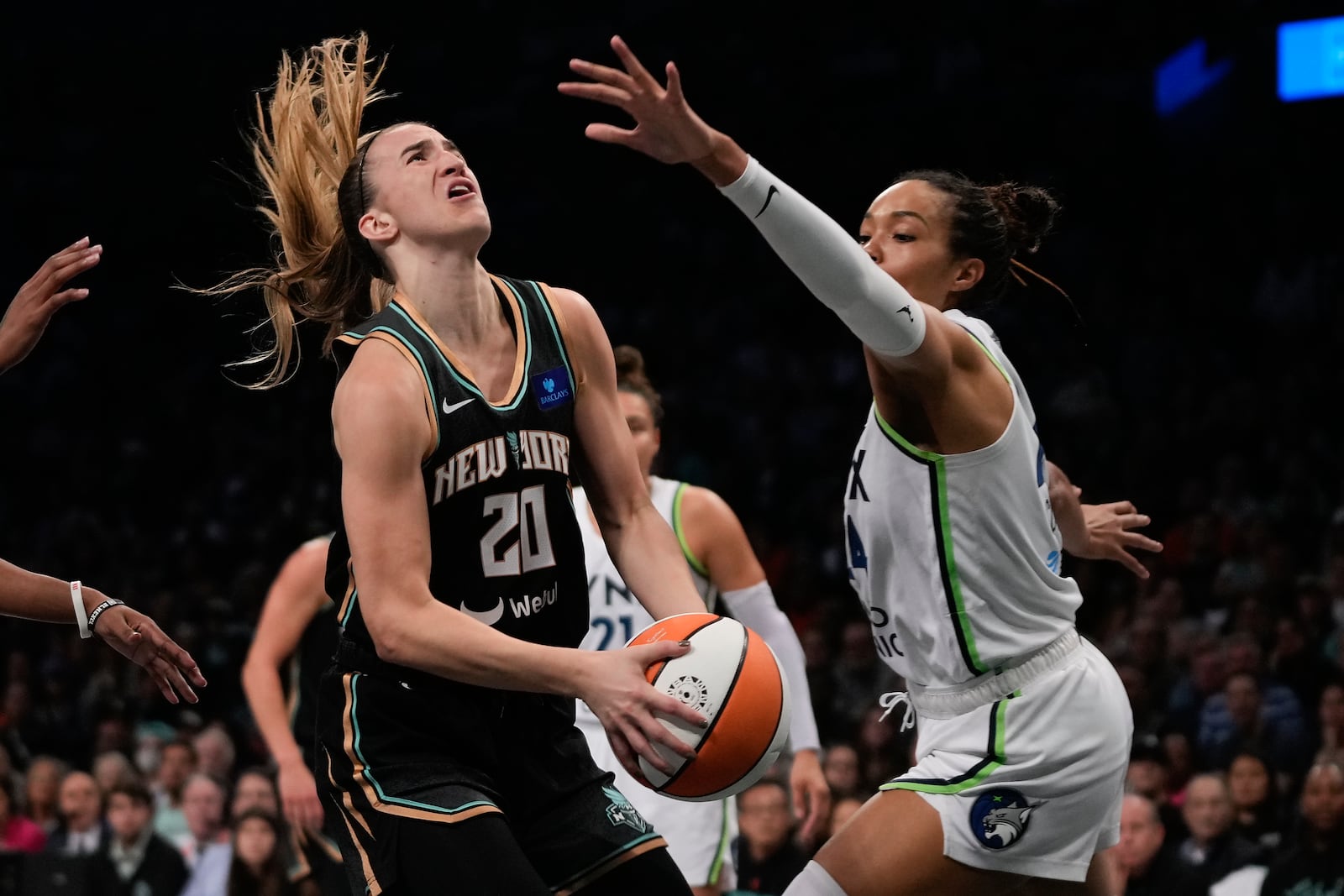 New York Liberty guard Sabrina Ionescu (20) goes up for a shot against Minnesota Lynx forward Napheesa Collier (24) during the first quarter of Game 5 of the WNBA basketball final series, Sunday, Oct. 20, 2024, in New York. (AP Photo/Pamela Smith)