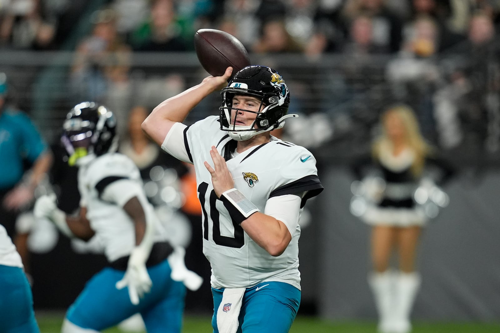 Jacksonville Jaguars quarterback Mac Jones throws against the Las Vegas Raiders during the first half of an NFL football game Sunday, Dec. 22, 2024, in Las Vegas. (AP Photo/John Locher)