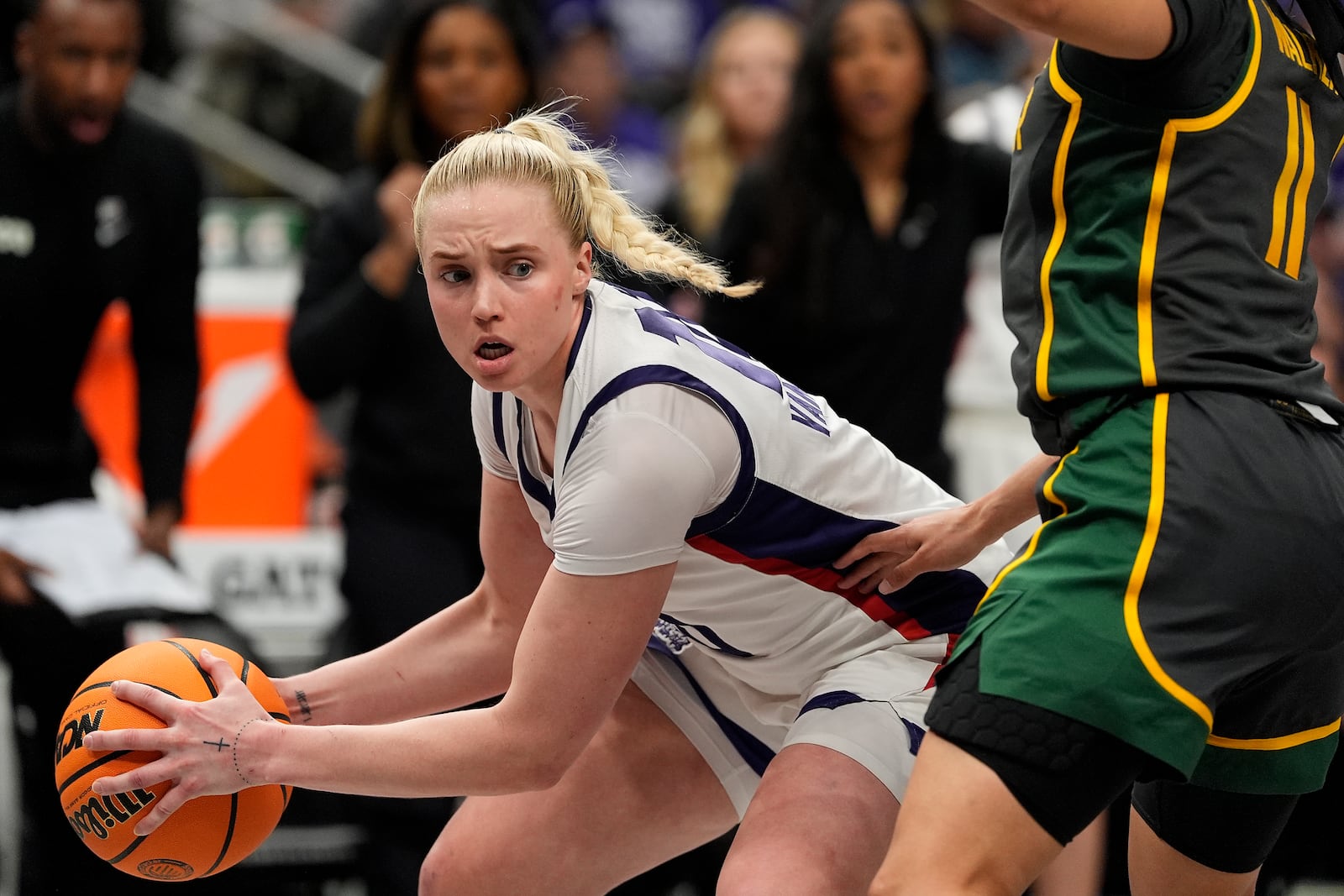 TCU guard Hailey Van Lith looks to pass around Baylor guard Jada Walker (11) during the second half of an NCAA college basketball game for the Big 12 women's tournament championship Sunday, March 9, 2025, in Kansas City, Mo. (AP Photo/Charlie Riedel)