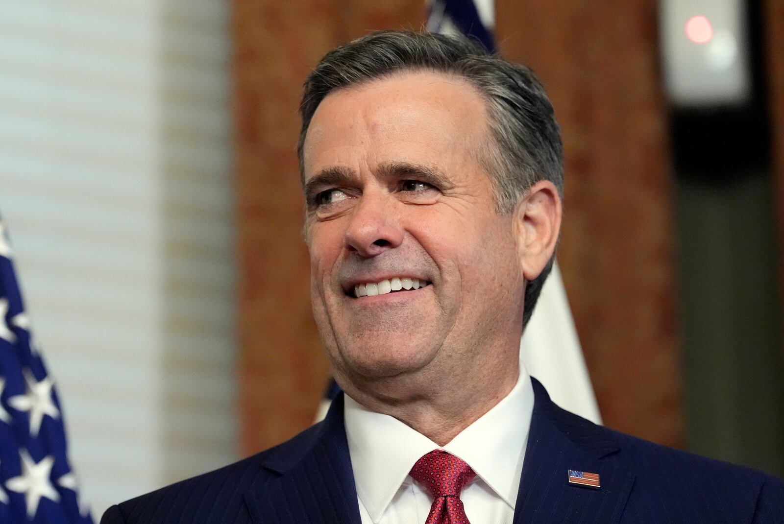 John Ratcliffe listens before Vice President JD Vance swears him in as CIA Director in the Vice Presidential ceremonial office in the Eisenhower Executive Office Building on the White House campus, Thursday, Jan. 23, 2025, in Washington. (AP Photo/Alex Brandon)