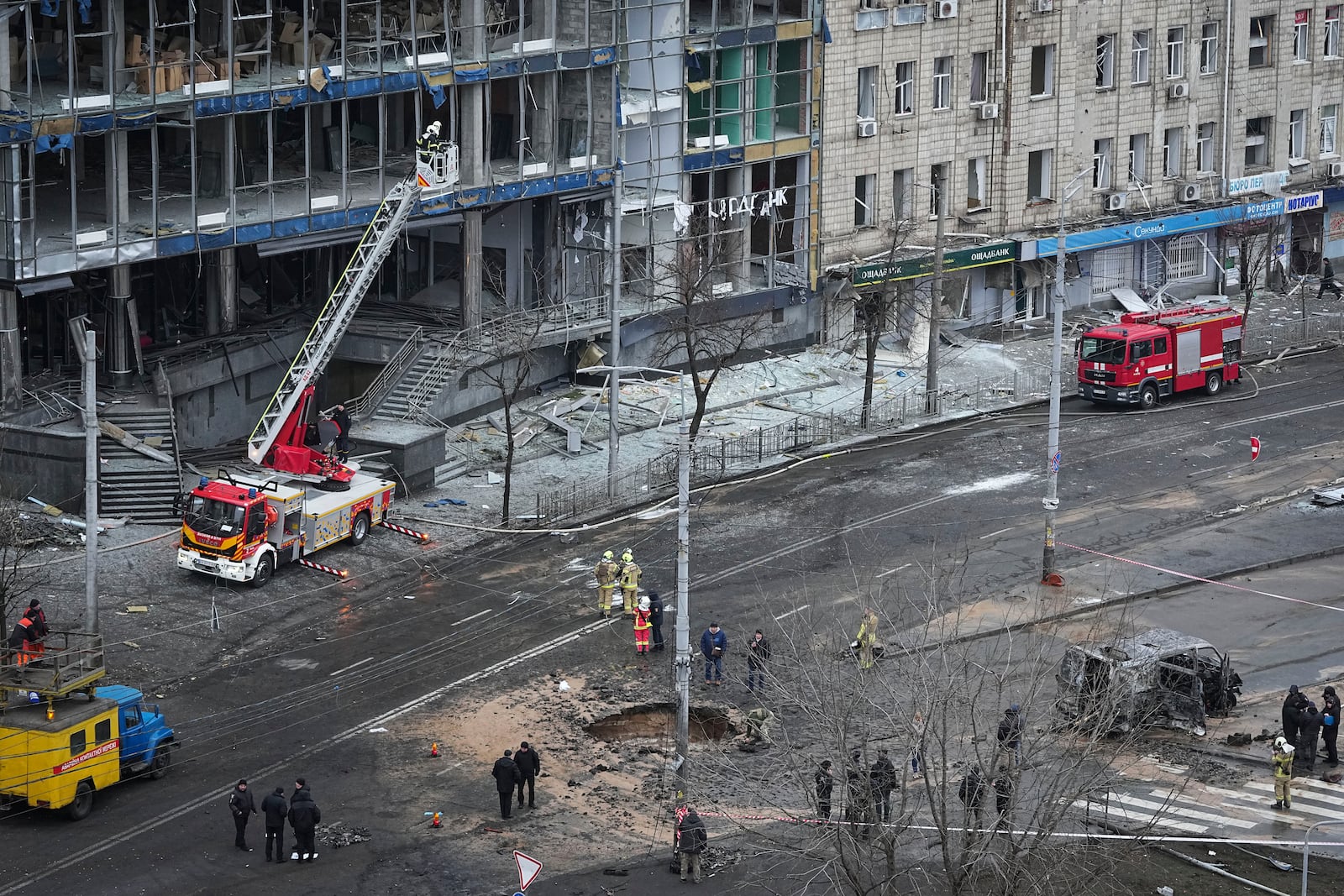 Firefighters work on the site of a damaged building after a Russian missile attack in Kyiv, Ukraine, Saturday, Jan. 18, 2025. (AP Photo/Efrem Lukatsky)