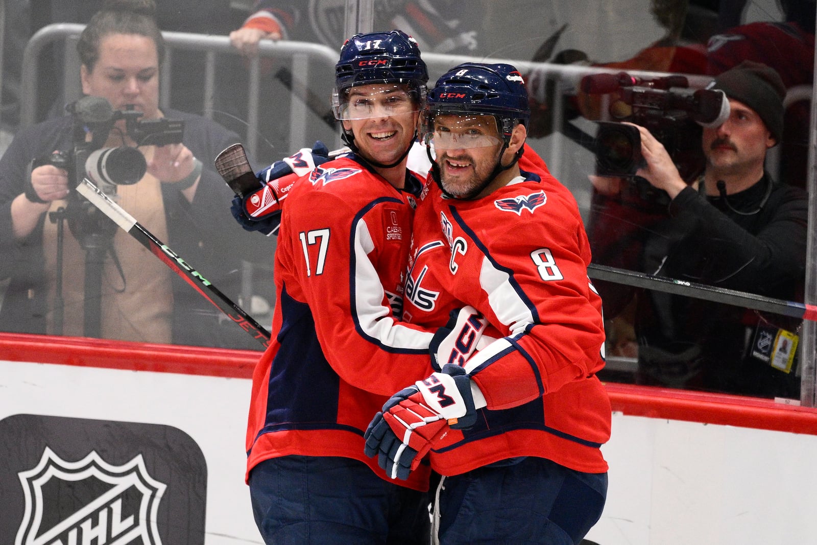 Washington Capitals center Dylan Strome (17) celebrates after his goal with left wing Alex Ovechkin (8) during the third period of an NHL hockey game against the Edmonton Oilers, Sunday, Feb. 23, 2025, in Washington. (AP Photo/Nick Wass)