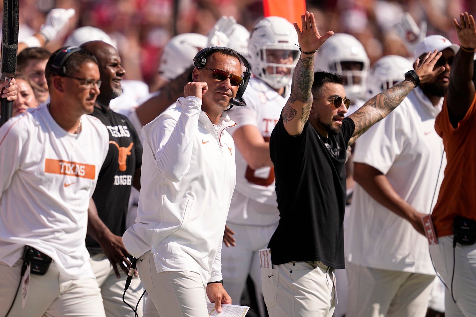 Texas head football coach Steve Sarkisian, center in white, pumps his fist after a missed Oklahoma field goal attempt in the first half of an NCAA college football game in Dallas, Saturday, Oct. 12, 2024. (AP Photo/Tony Gutierrez)