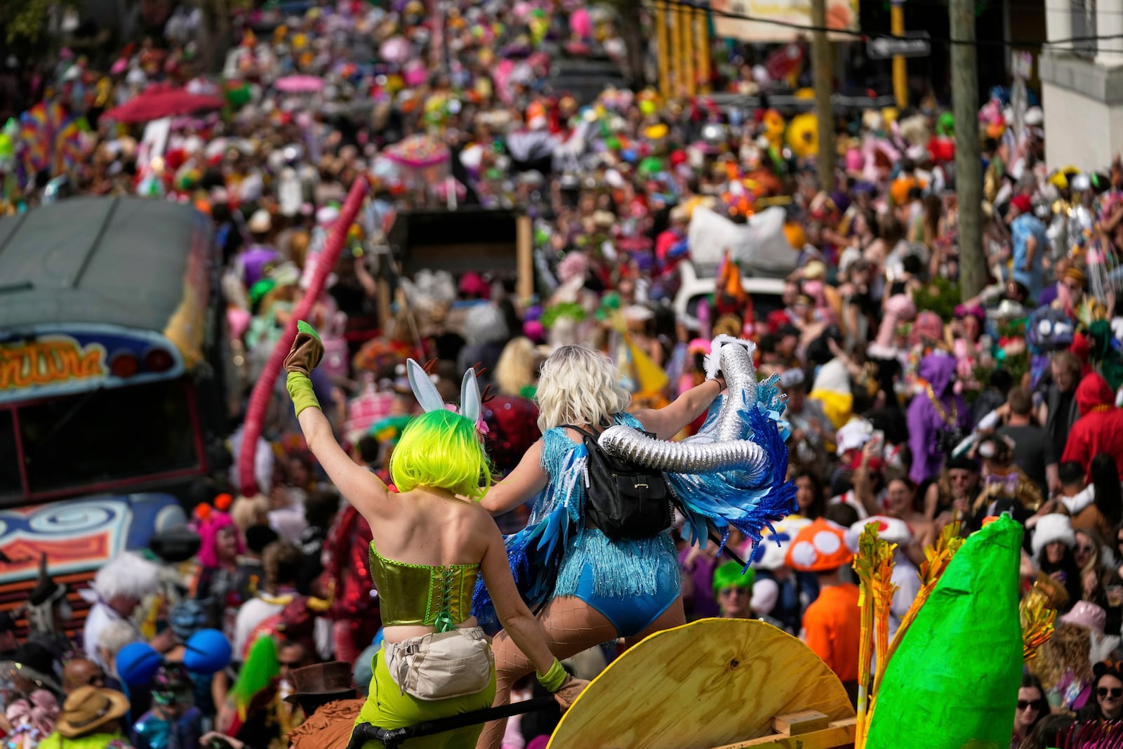 People participate in the Society of Saint Anne's parade on Mardi Gras Day, Tuesday, March 4, 2025 in New Orleans. (AP Photo/Gerald Herbert)