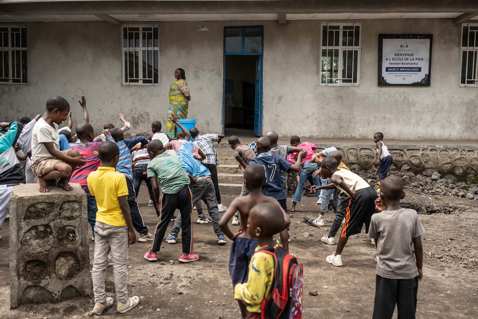 Children play in a school named after Floribert Bwana Chui Bin Kositi, a Congolese man killed for fighting corruption in 2007, and whose beatification was approved by Pope Francis, in Goma, Democratic Republic of Congo, Sunday, Dec. 29, 2024. (AP Photo/Moses Sawasawa)