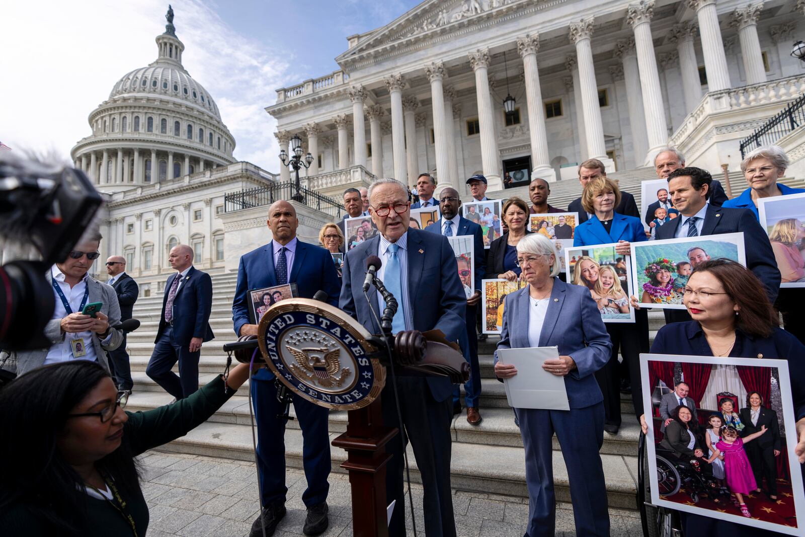 Senate Majority Leader Chuck Schumer, D-NY, center, accompanied by Sen. Cory Booker, D-NJ., left, Sen. Patty Murray, D-Wash., center-right, and Sen. Tammy Duckworth, D-Ill., right, speaks about the need to protect rights to in vitro fertilization (IVF), on the Senate steps at Capitol in Washington, Tuesday, Sept. 17, 2024. (AP Photo/Ben Curtis)