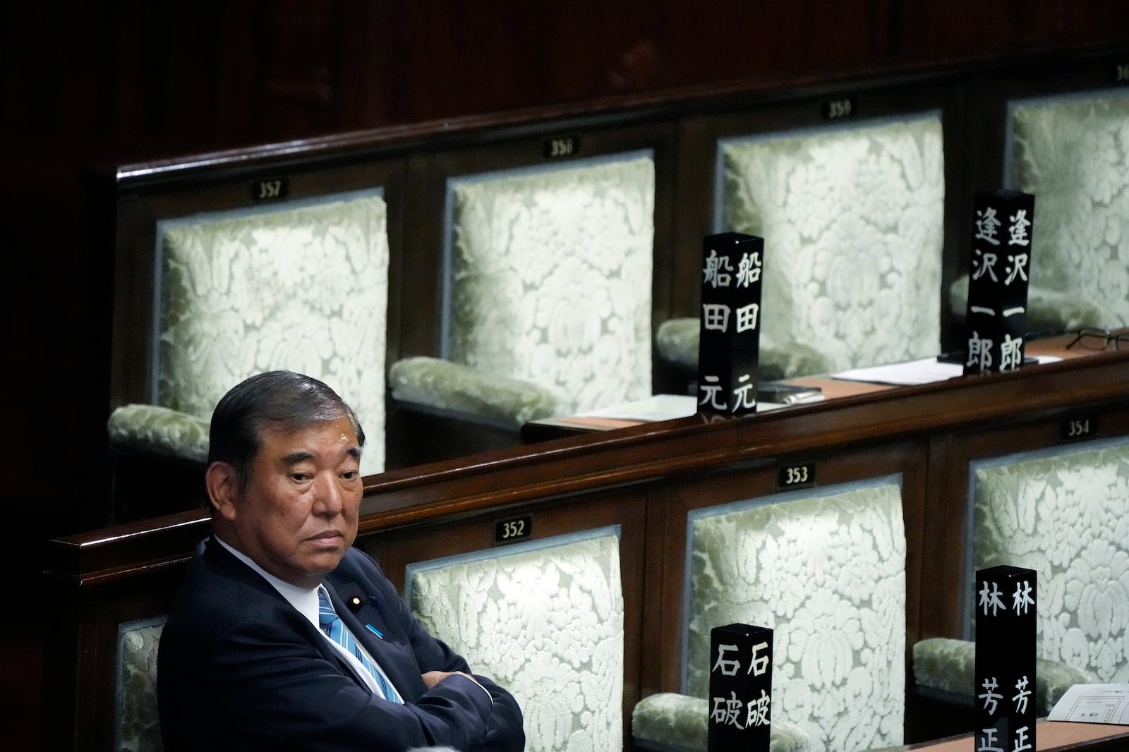 FILE - Japanese Prime Minister Shigeru Ishiba waits after the first vote for a new prime minister at a special parliamentary session of the lower house Monday, Nov. 11, 2024, in Tokyo. (AP Photo/Eugene Hoshiko, file)