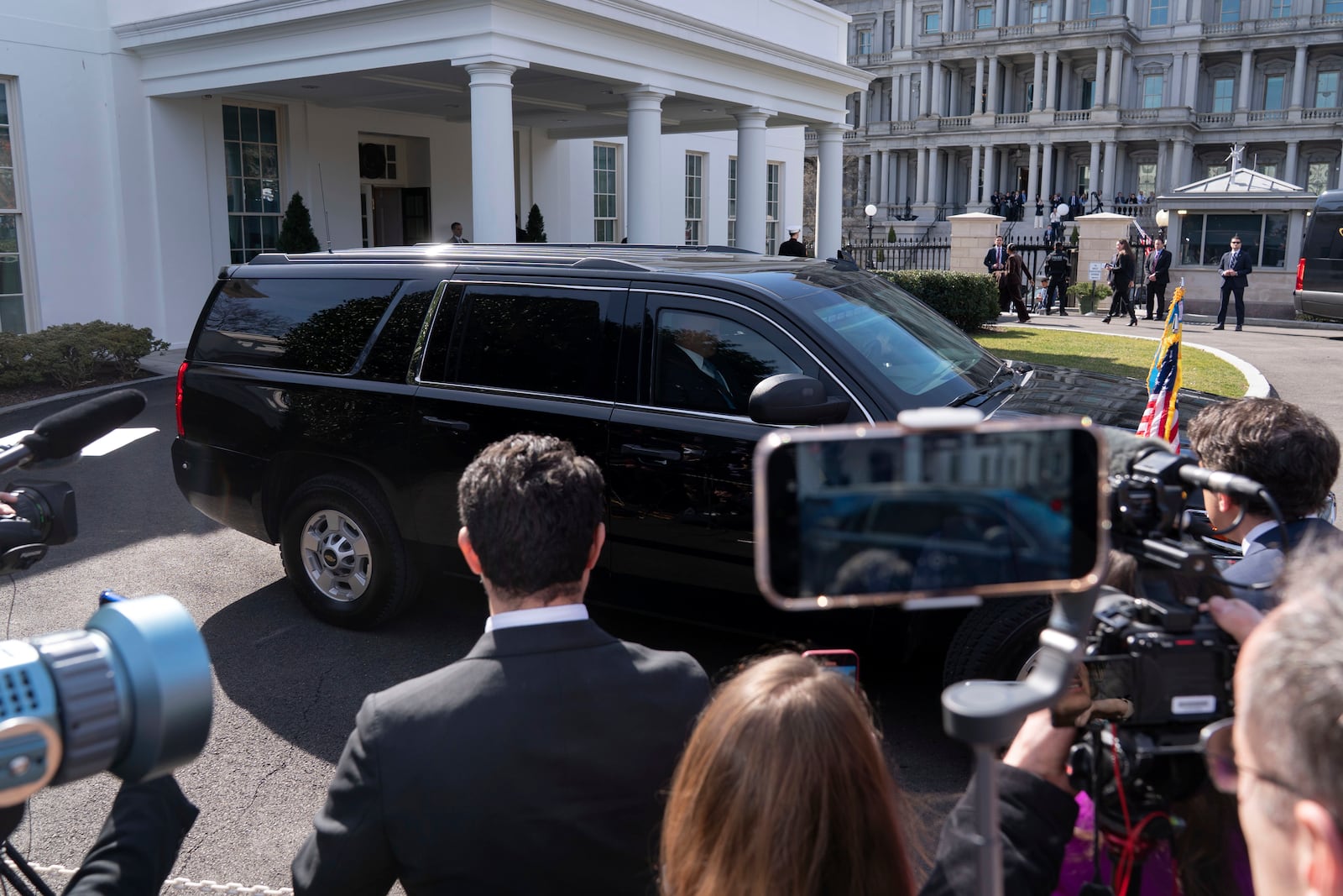 A vehicle with Ukraine's President Volodymyr Zelenskyy on board departs after a meeting with President Donald Trump at the White House in Washington, Friday, Feb. 28, 2025. (AP Photo/Jose Luis Magana)