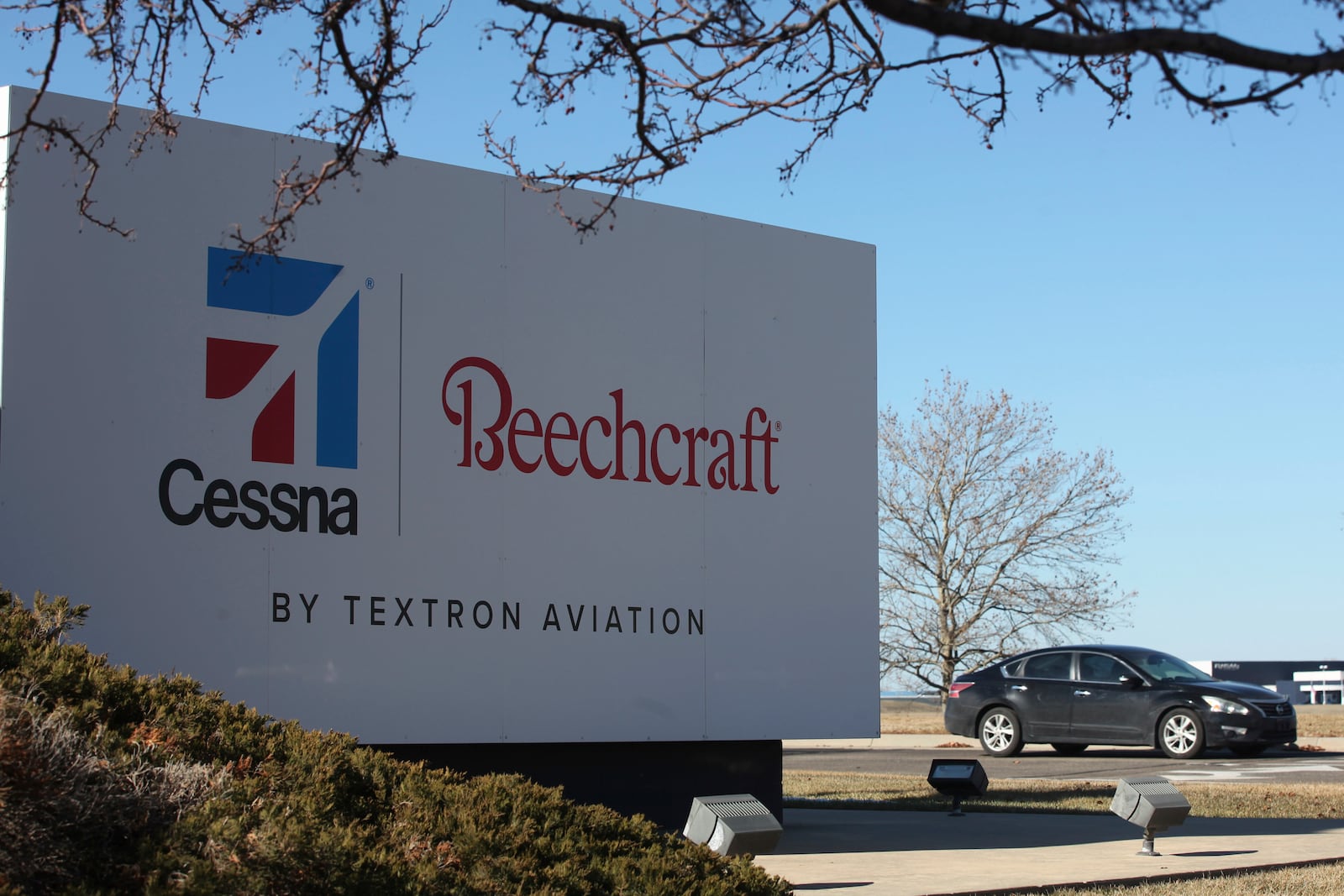 A sign marks an entrance to a plant for Textron Inc., which manufactures Cessna and Beechcraft airplanes, Friday, Jan. 31, 2025, in Wichita, Kan. (AP Photo/John Hanna)