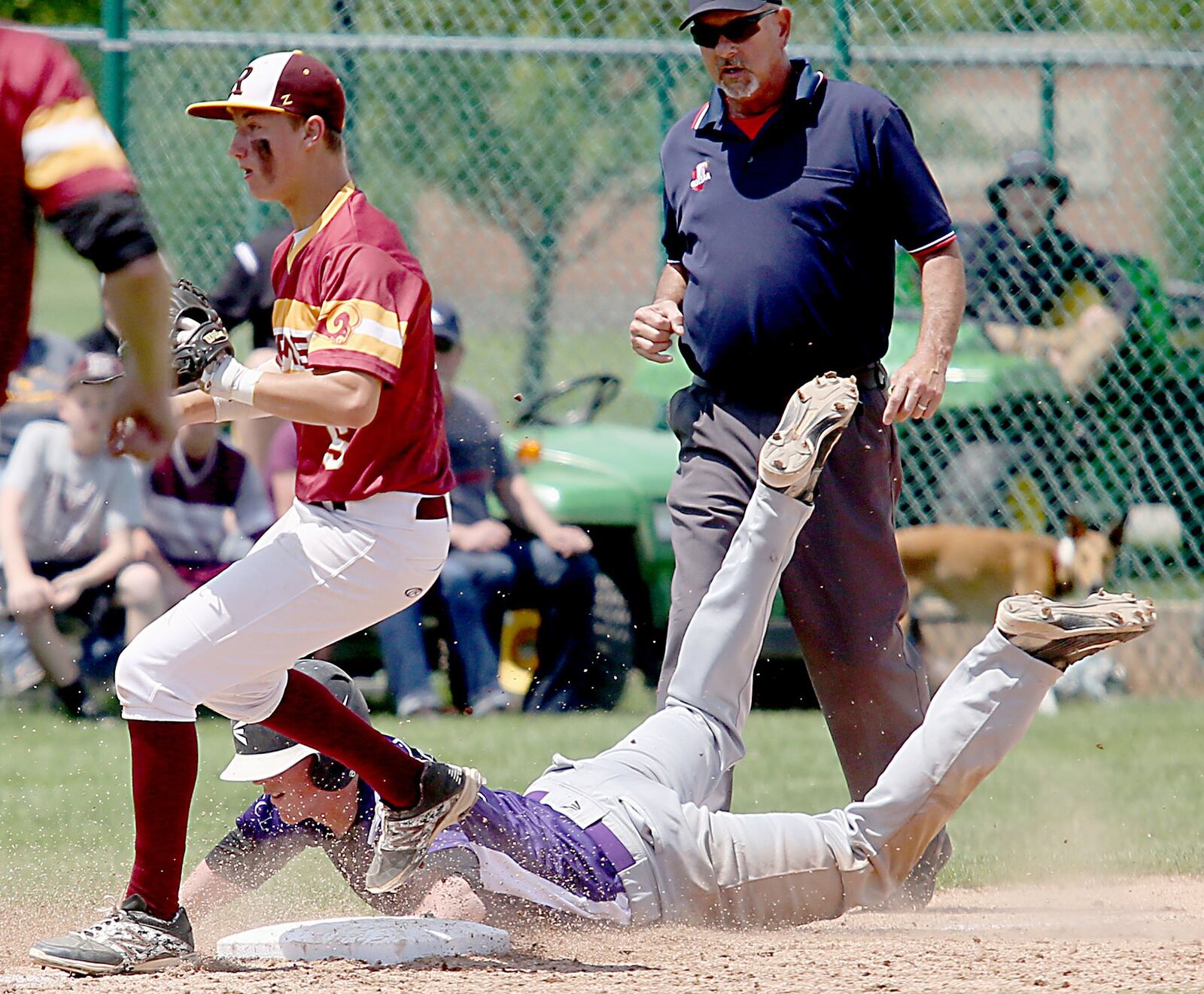 Ross third baseman Zach Evans gets the out on Drew McLuckie of Columbus DeSales during their Division II regional semifinal at Mason on Friday. CONTRIBUTED PHOTO BY E.L. HUBBARD