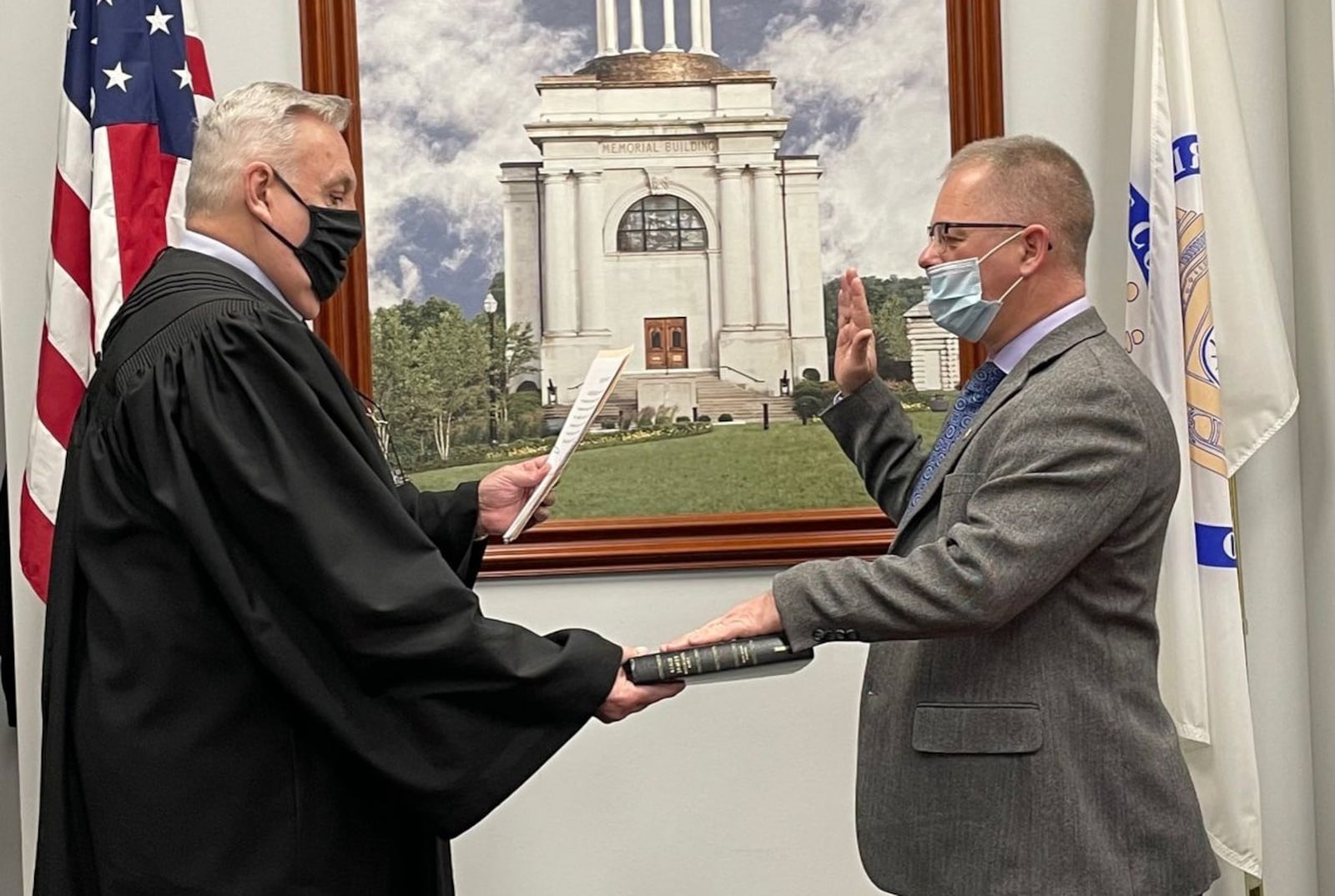 Butler County Common Pleas Court Judge Noah Powers swears in the newest member of the Veterans Service Commission Jim Eriksen on Jan. 20, 2021.