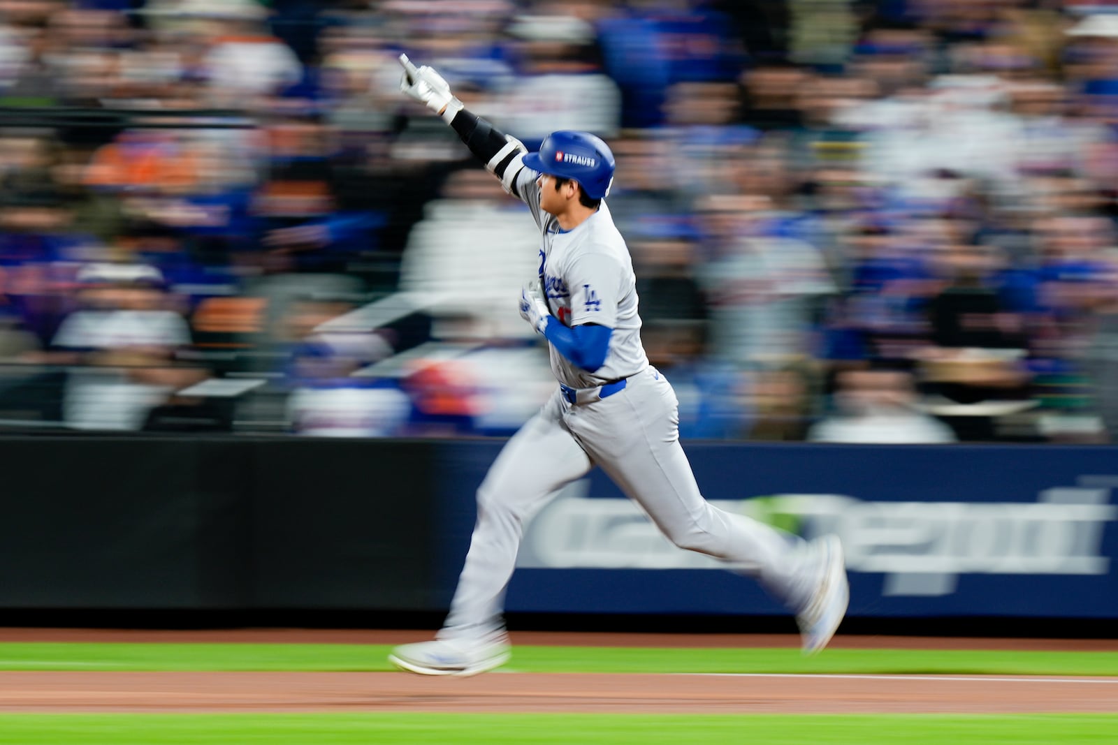 Los Angeles Dodgers' Shohei Ohtani celebrates after a home run against the New York Mets during the first inning in Game 4 of a baseball NL Championship Series, Thursday, Oct. 17, 2024, in New York. (AP Photo/Frank Franklin II)