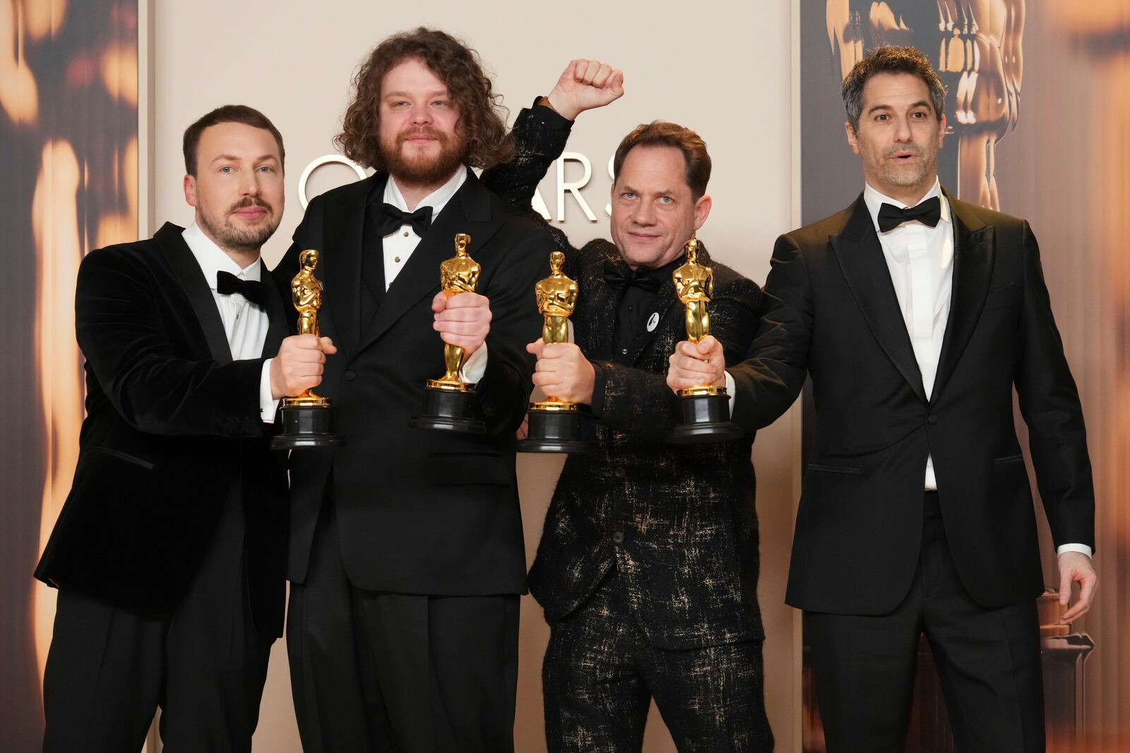 From left, Gints Zilbalodis, Matiss Kaza, Ron Dyens and Gregory Zalcman, winners of the award for best animated feature film for "Flow," pose in the press room at the Oscars on Sunday, March 2, 2025, at the Dolby Theatre in Los Angeles. (Photo by Jordan Strauss/Invision/AP)