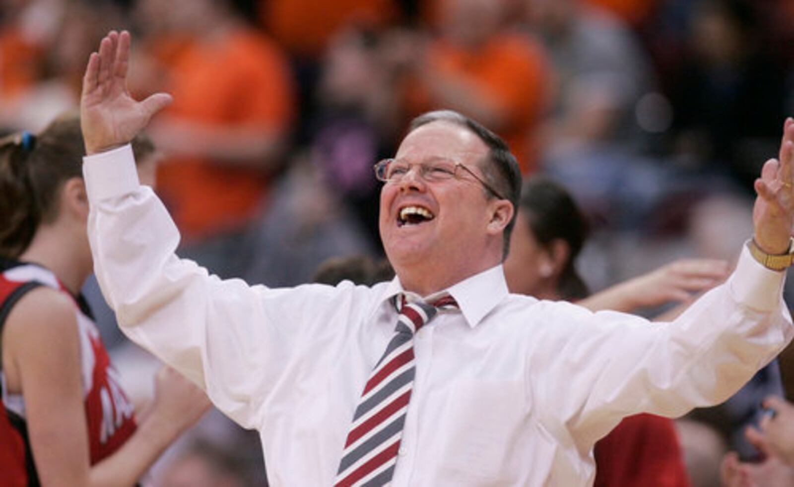 John Rossi, head basketball coach of Madison High School, celebrates earning a trip to the Division III state title game in 2010. The Mohawks lost in the state final. Rossi was inducted last week into the Butler County Sports Hall of Fame. FILE PHOTO