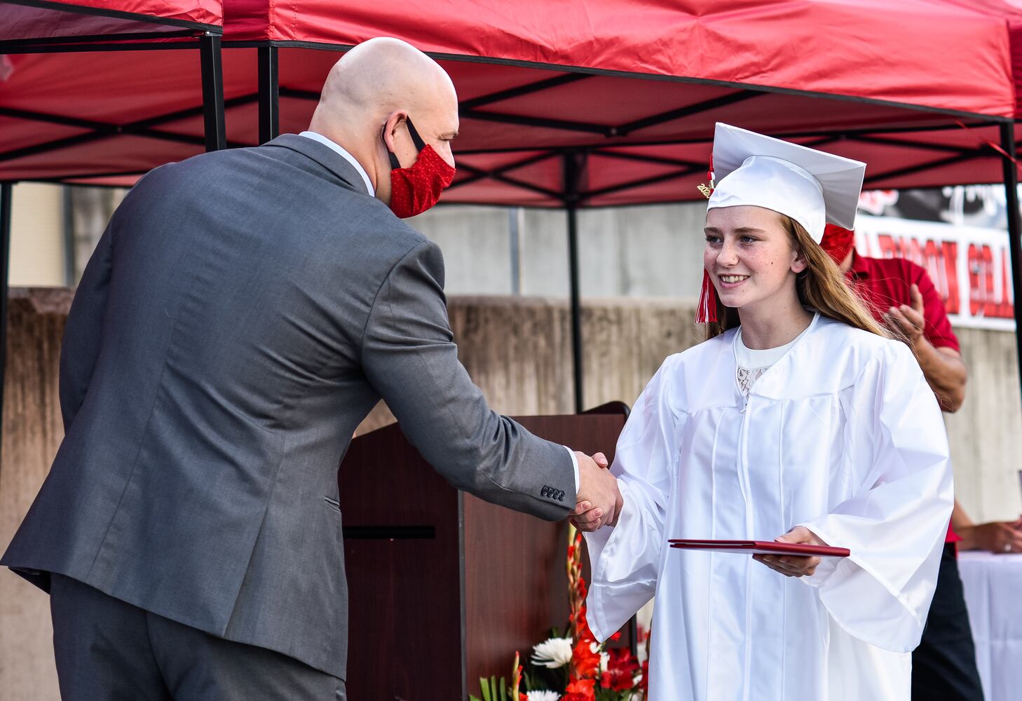 Madison High School drive-thru graduation ceremony at Land of Illusion