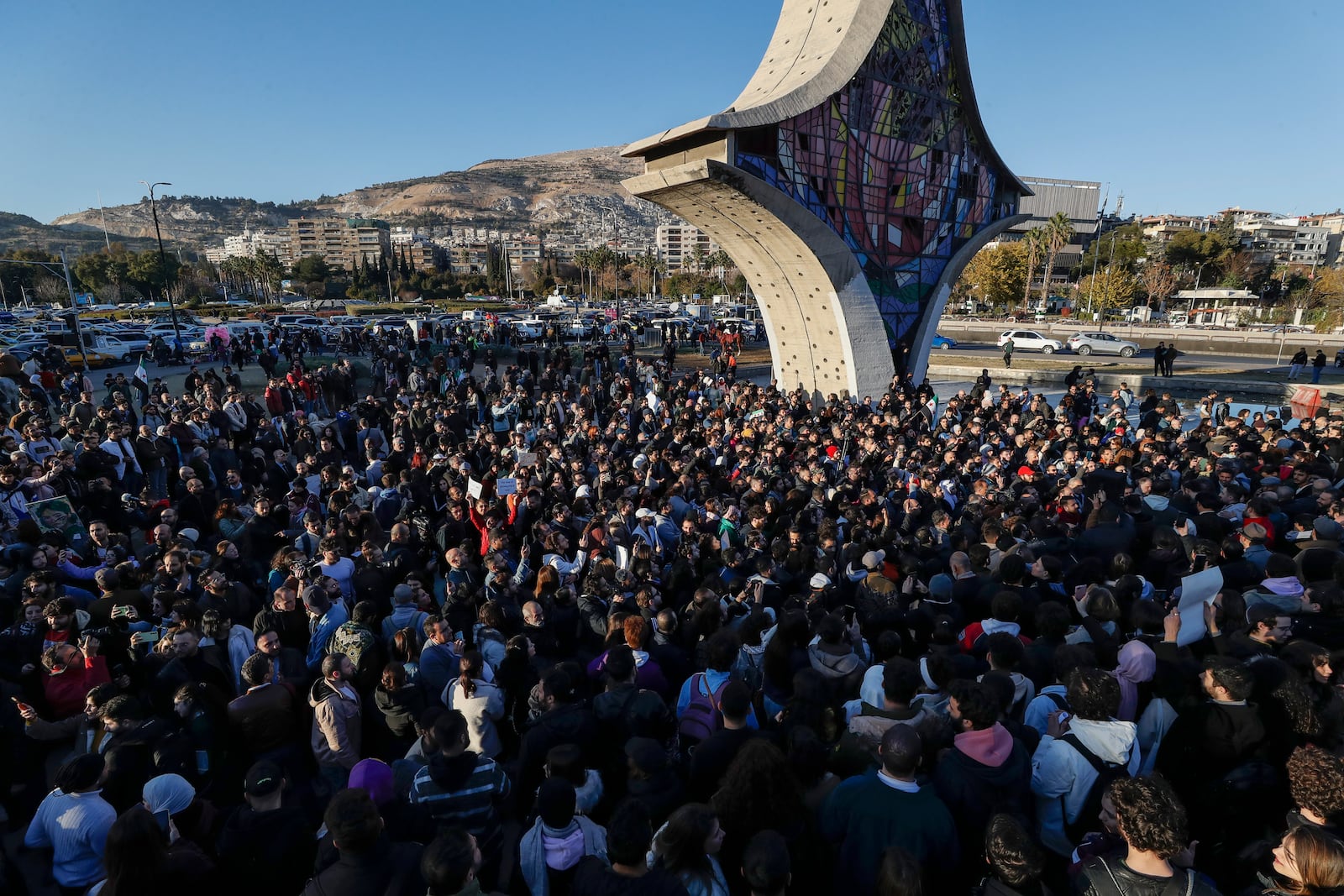 Syrian activists gather at the Umayyad square during a protest to demand a secular state, in Damascus, Syria, Thursday, Dec. 19, 2024. (AP Photo/Omar Sanadiki)