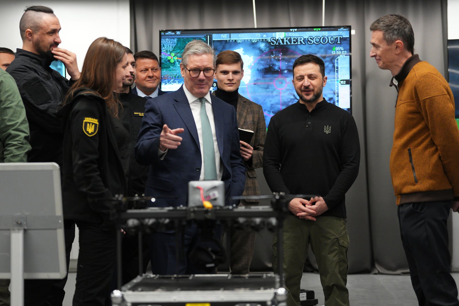 British Prime Minister Keir Starmer, center, and Ukrainian President Volodymyr Zelenskyy, second right, attend a presentation of Ukrainian military drones at an undisclosed location in Kyiv, Ukraine, Thursday, Jan. 16, 2025. (Carl Court, Pool Photo via AP)