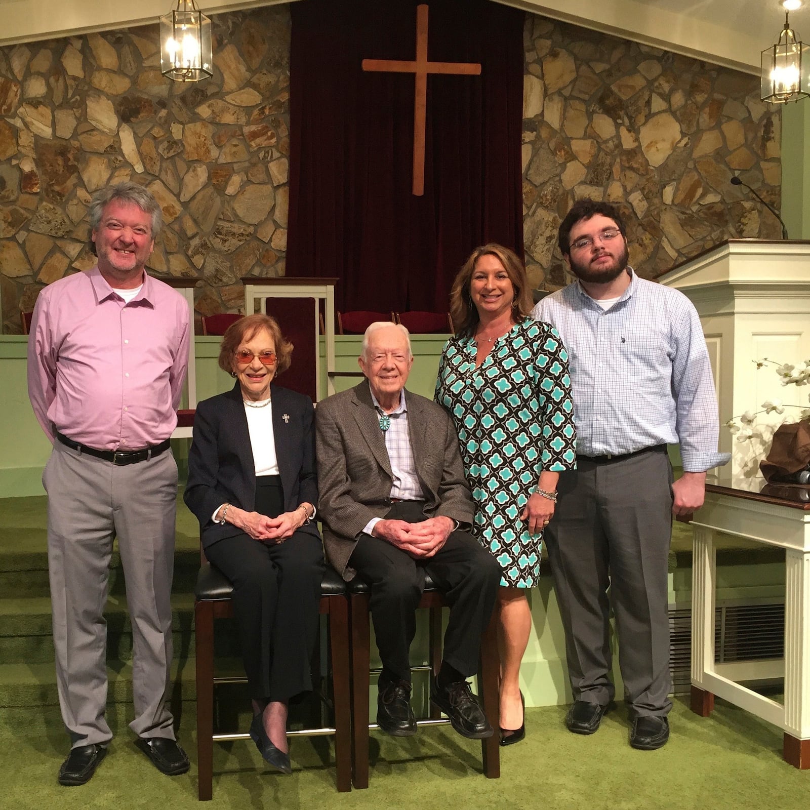 This photo provided by AP reporter Paul Newberry shows Newberry, his wife Linda and son Hudson with Rosalynn and Jimmy Carter in the Maranatha Baptist Church in Plains, Ga., March 27, 2016. (Paul Newberry via AP)