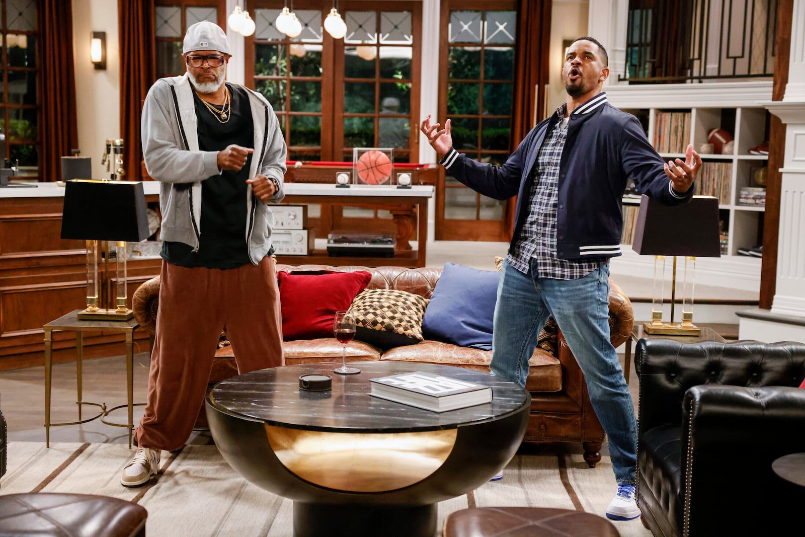 This image released by CBS shows Damon Wayans, left, and Damon Wayans Jr., in a scene from "Poppa's House." (Robert Voets/CBS via AP)