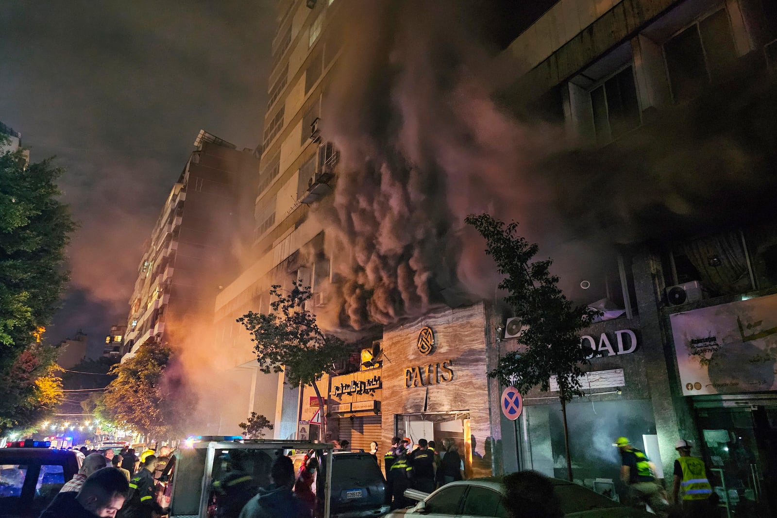 Civil defense workers extinguish a fire at the site of an Israeli airstrike in Beirut, Sunday, Nov. 17, 2024. (AP Photo/Hassan Ammar)