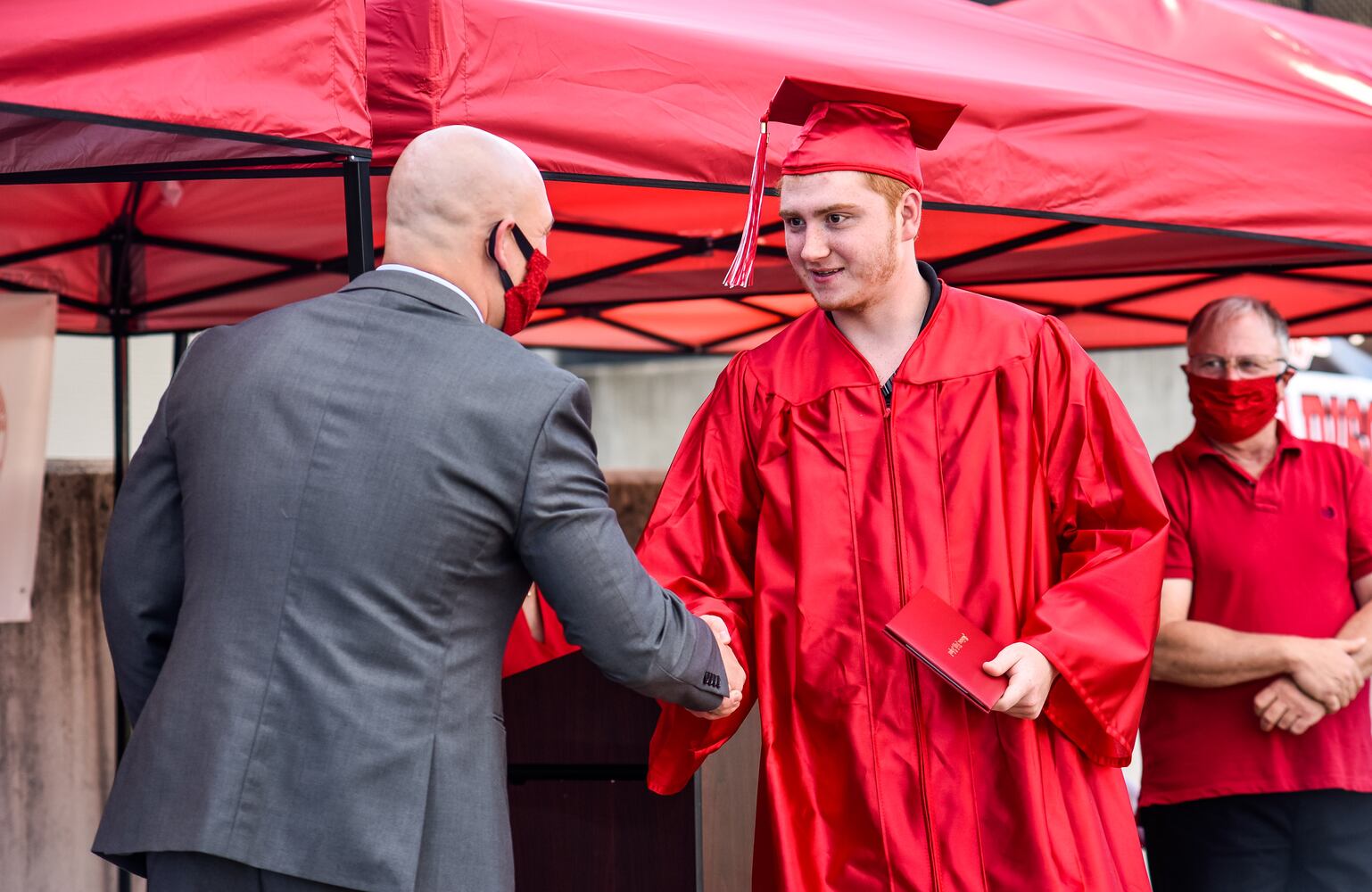 Madison High School drive-thru graduation ceremony at Land of Illusion