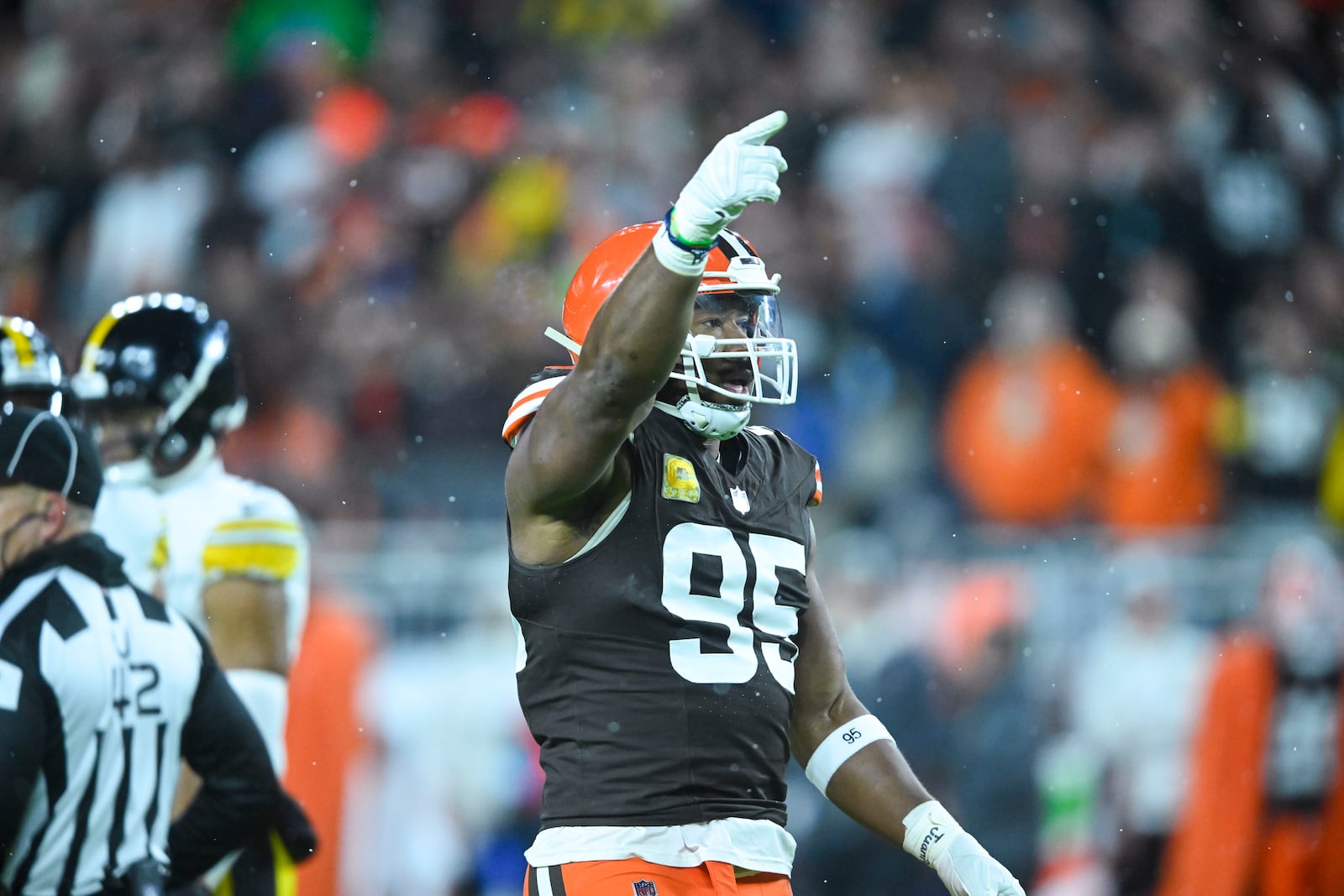 Cleveland Browns defensive end Myles Garrett (95) reacts after a defensive stop in the first half of an NFL football game against the Pittsburgh Steelers, Thursday, Nov. 21, 2024, in Cleveland. (AP Photo/David Richard)