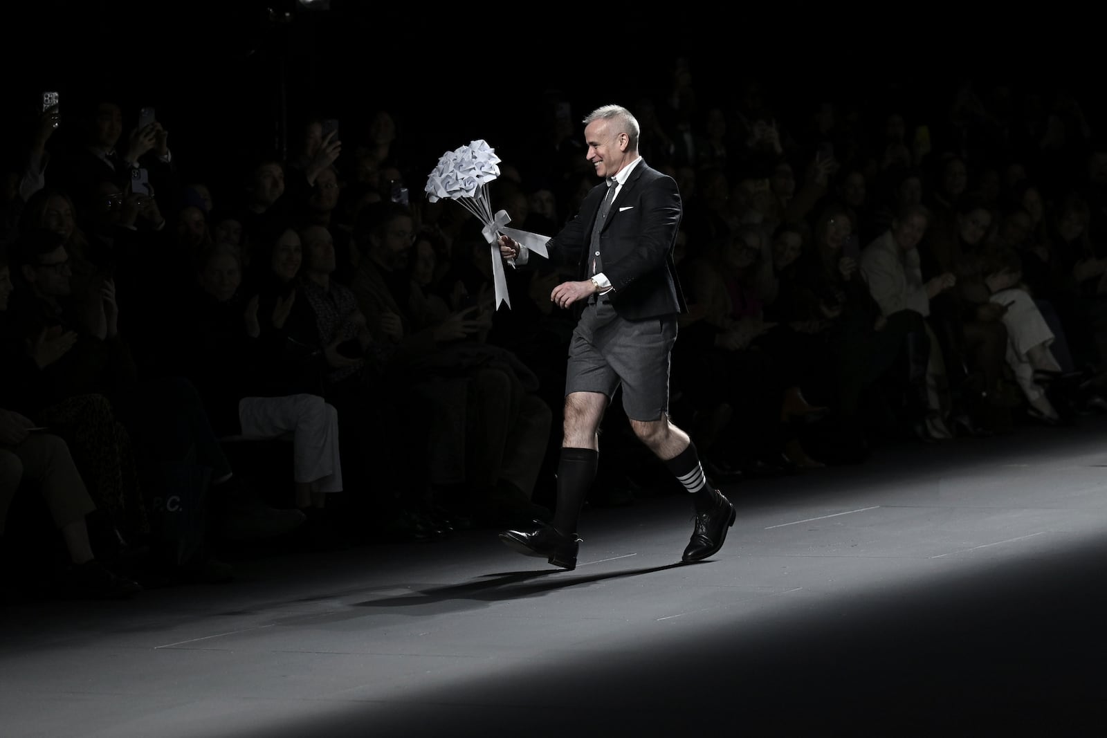 Designer Thom Browne accepts applause after the Thom Browne Fall/Winter 2025 fashion show as part of New York Fashion Week on Tuesday, Feb. 11, 2025, at The Shed in New York. (Photo by Evan Agostini/Invision/AP)