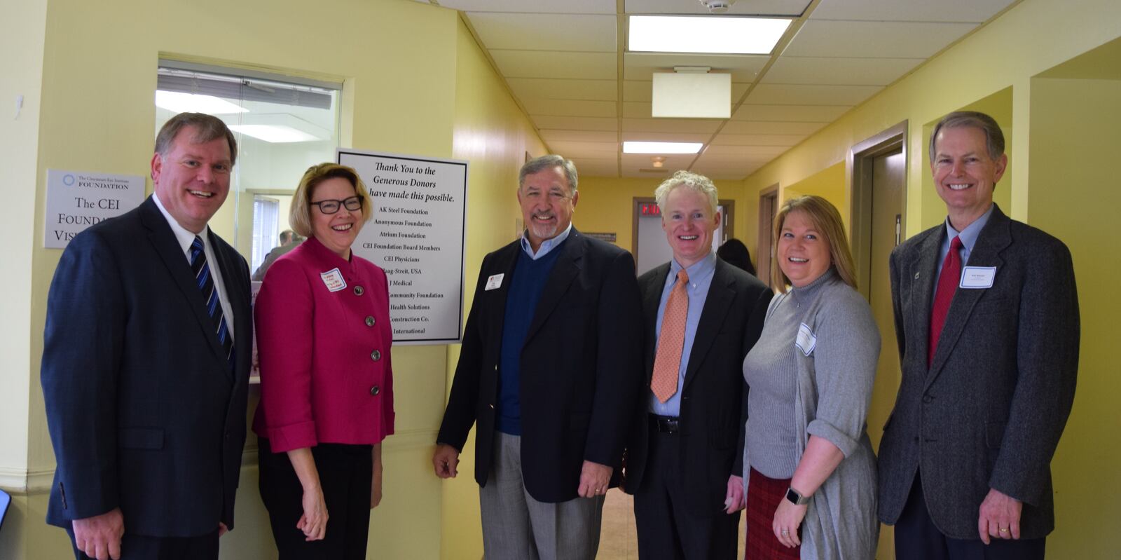 The new CEI Foundation Vision Clinic for Middletown’s underserved adults is possible through community effort. From left include: Mike Stautberg, president of the Atrium Medical Center Foundation; Lisa Jester, corporate manager of communications and public relations for AK Steel Corporation; Dan Sack, interim director for the Middletown Community Foundation; Joe Mulligan of Middletown City Council; Kristen Mulligan, finance and scholarship manager with the Middletown Community Foundation; and Bob Wassler, president of Oswald Company, Inc. and a CEI Foundation board member. Not pictured are donors from Haag-Streit Holdings, U.S., Inc. and Reliance Medical Products, Inc., which donated diagnostic equipment for the clinic. (Oak Tree Communications Photo)