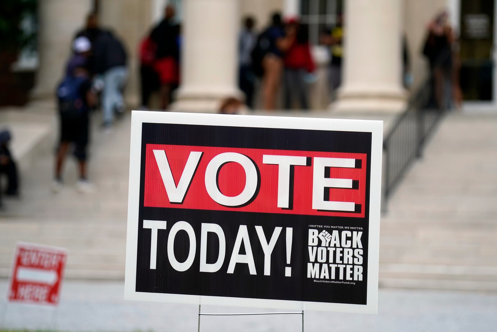 A sign encouraging students to vote is shown outside the Dudley Building polling place during a get out the vote rally at North Carolina A&T in Greensboro, N.C., Monday, Oct. 28, 2024. (AP Photo/Chuck Burton)