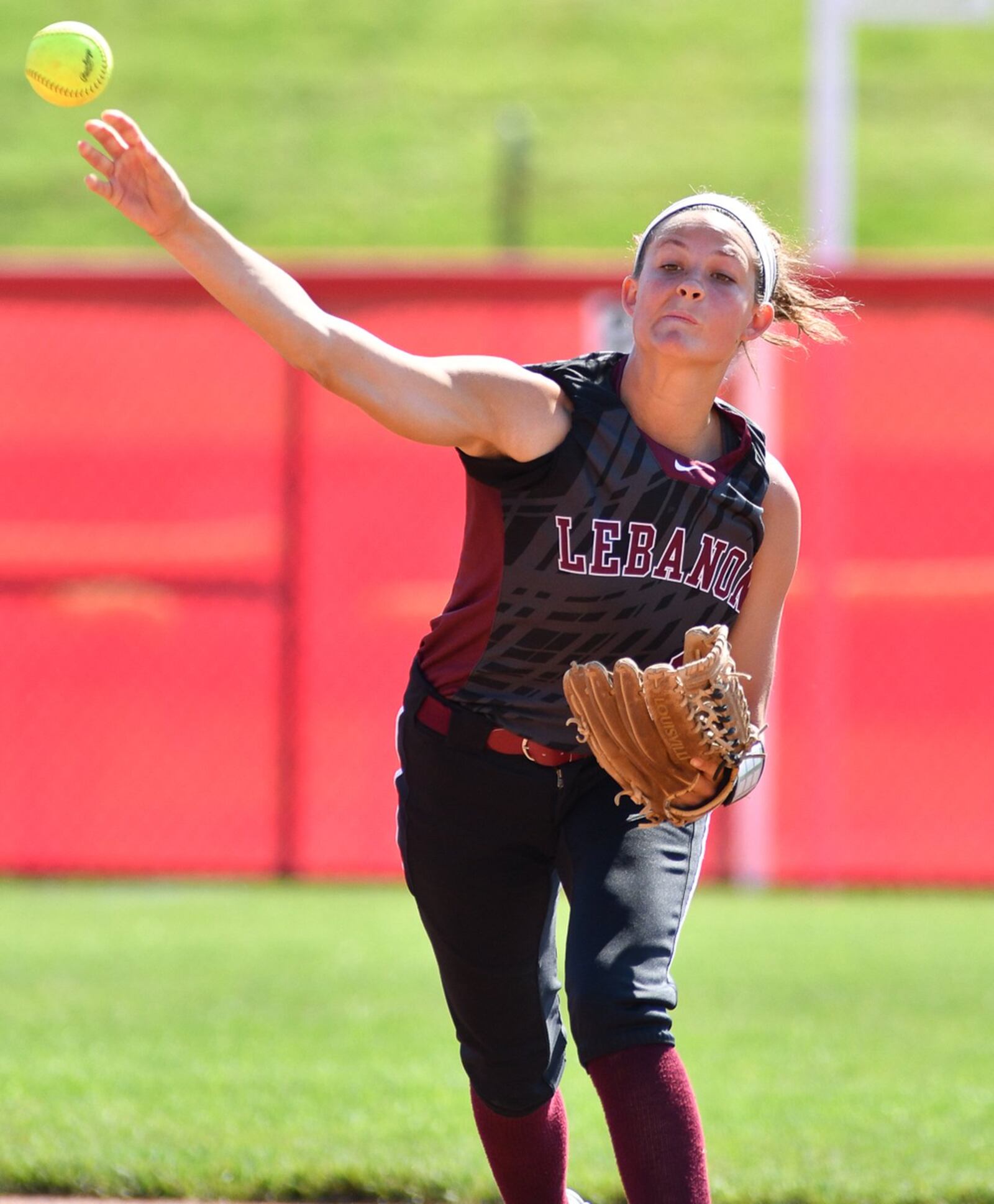 Lebanon shortstop Ashley West makes a throw to first base during Saturday’s Division I state final against Elyria at Firestone Stadium in Akron. CONTRIBUTED PHOTO BY BRYANT BILLING